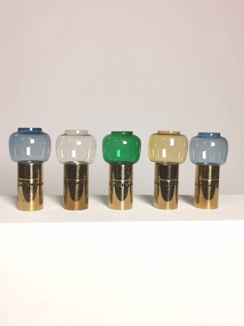 Hans-Agne Jakobsson, collection of five candleholders,
colored glass, brass, 
manufactured by Markaryd,
Sweden, 1960s.
