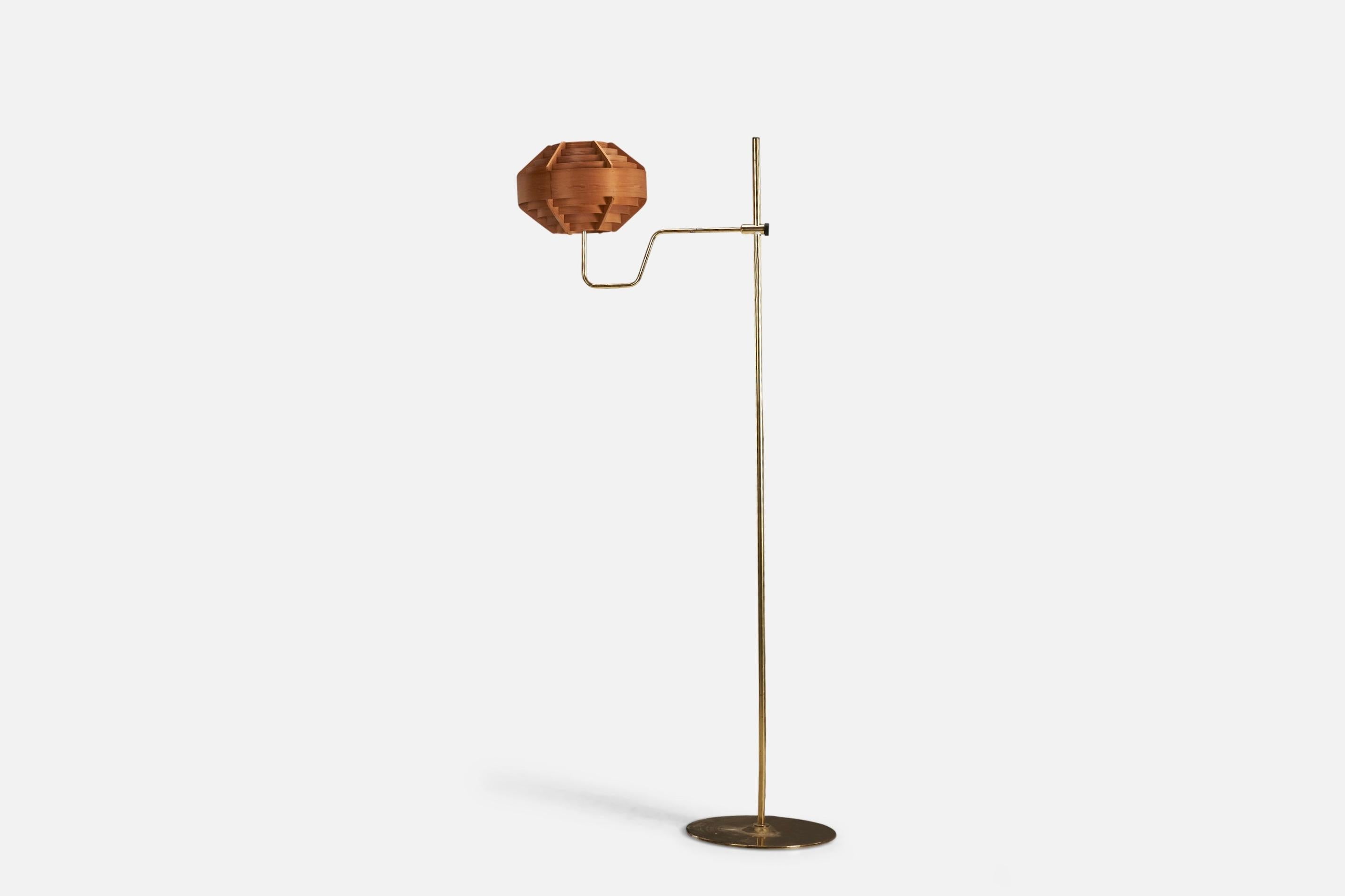 A brass and moulded wood veneer floor lamp designed and produced by Hans-Agne Jakobsson, Sweden, 1970s.

Lampshade assorted to base.

Socket takes standard E-26 medium base bulb.

There is no maximum wattage stated on the fixture.