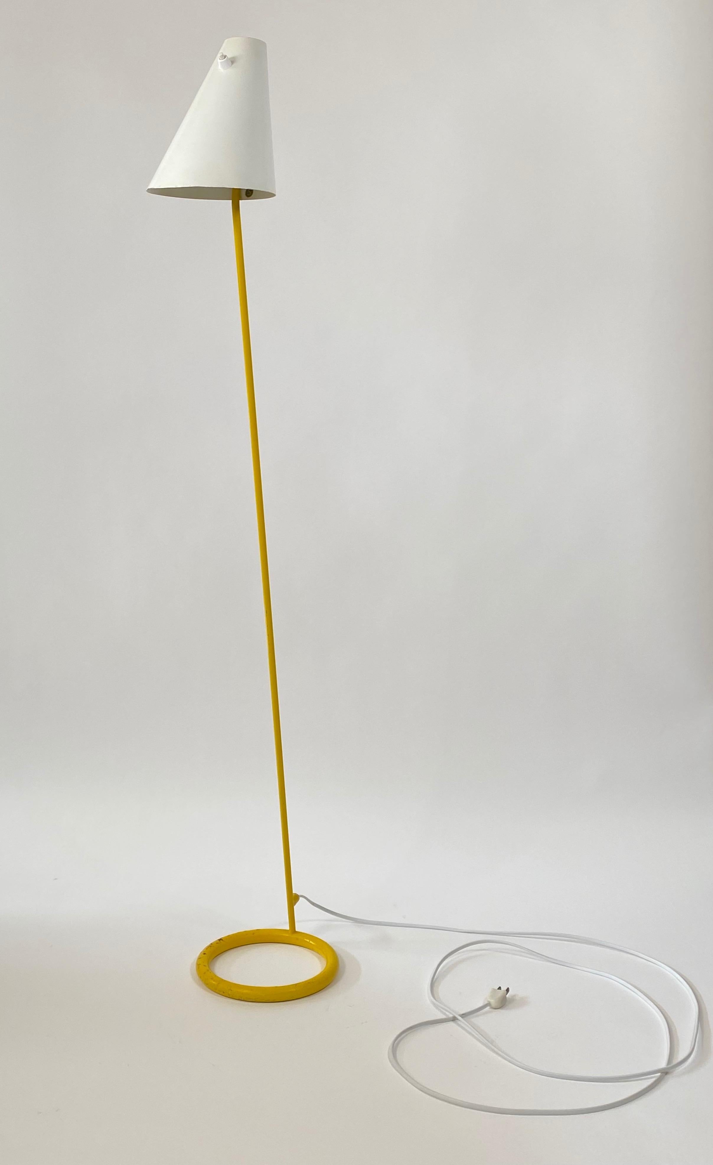 Floor lamp by Hans-Agne Jakobsson for Haj Markaryd of Sweden. We keep the original finish with its patina and rewired the lamp as per it original specifications, ordering parts from Europe. The lamp has a weighted steel ring base in yellow with an