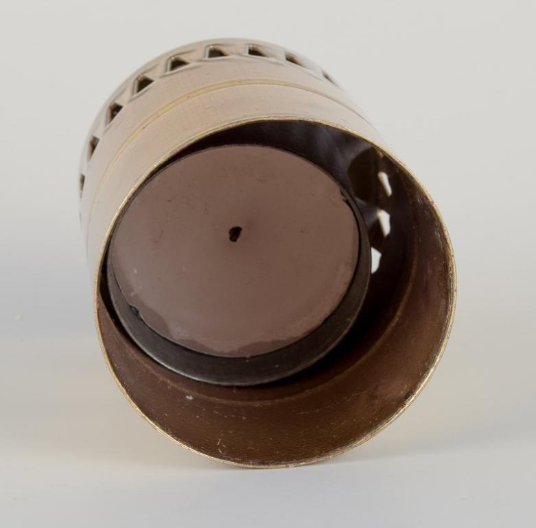 Late 20th Century Hans-Agne Jakobsson for A/B Markaryd. Candle holder in brass and red glass.