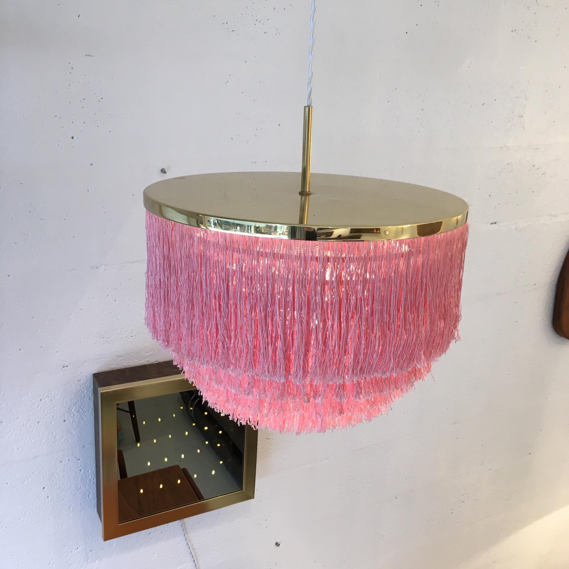 A Hans-Agne Jakobsson for Markaryd pink silk fringed pendant with brass frame, model T-603, dating from the 1960s and manufactured in Sweden.