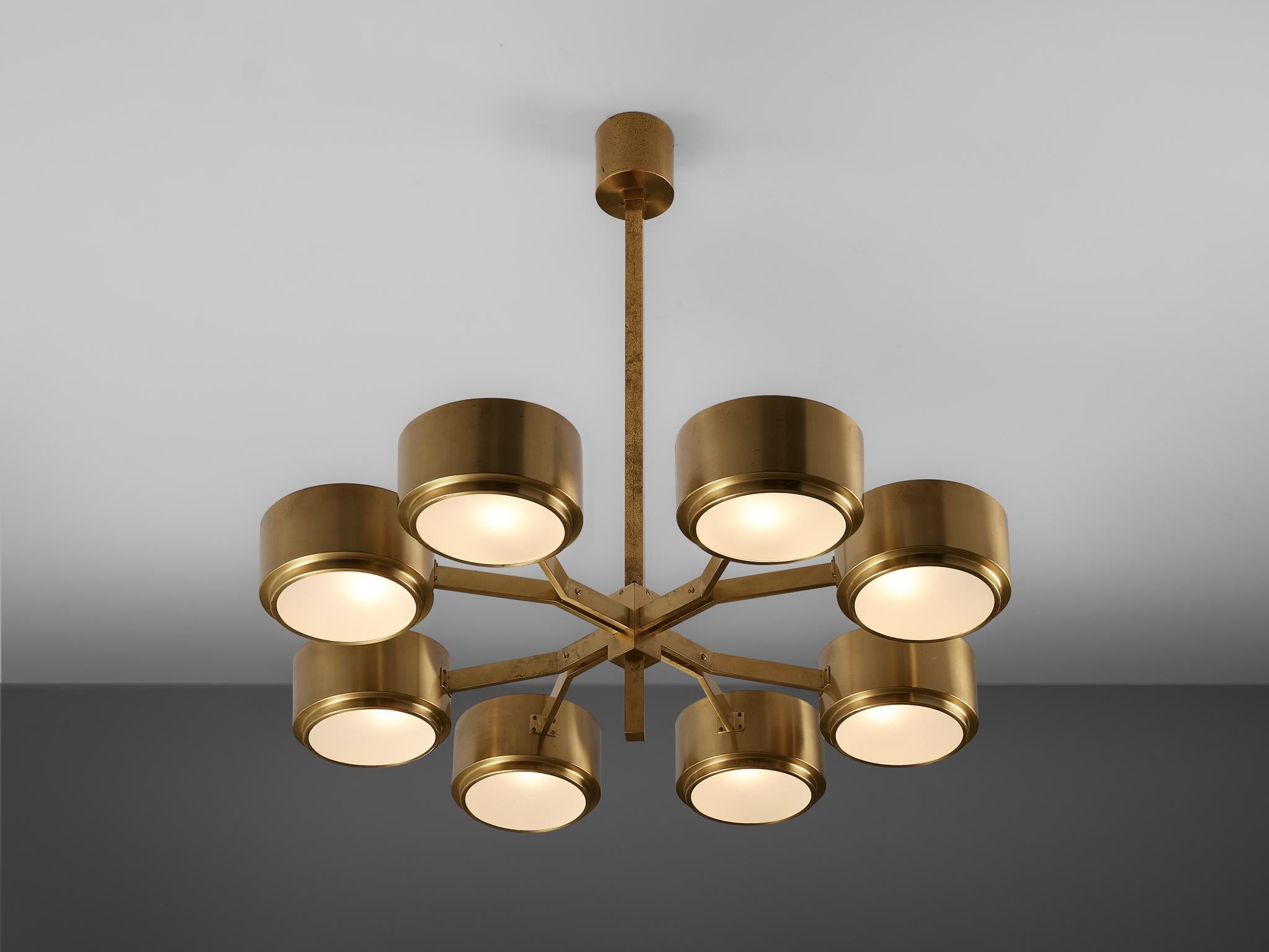 Hans-Agne Jakobsson for Markaryd, chandelier in brass, glass, Sweden, 1970s

Distinct Hans-Agne Jakobsson chandelier with eight cylindrical lights arranged in a circle. The gold coloured brass gives the design a luxurious look. 

Hans-Agne Jakobsson