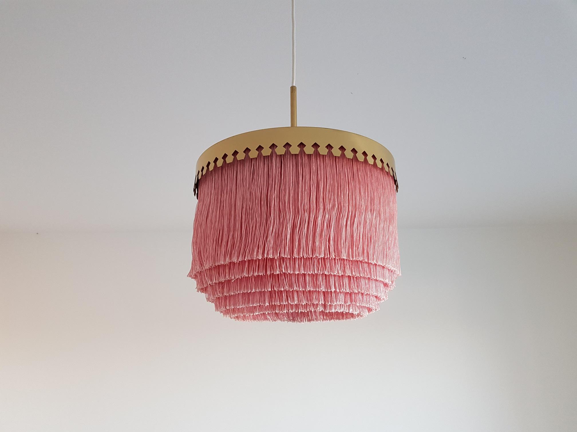 Vintage pink fringe lamp in brass. Produced in the 1960s by Hans-Agne Jakobsson AB in Markaryd Sweden. This famous ceiling lamp has had an unbelievable revival the last few years and is now found in the most iconic hotel lounges, private homes,