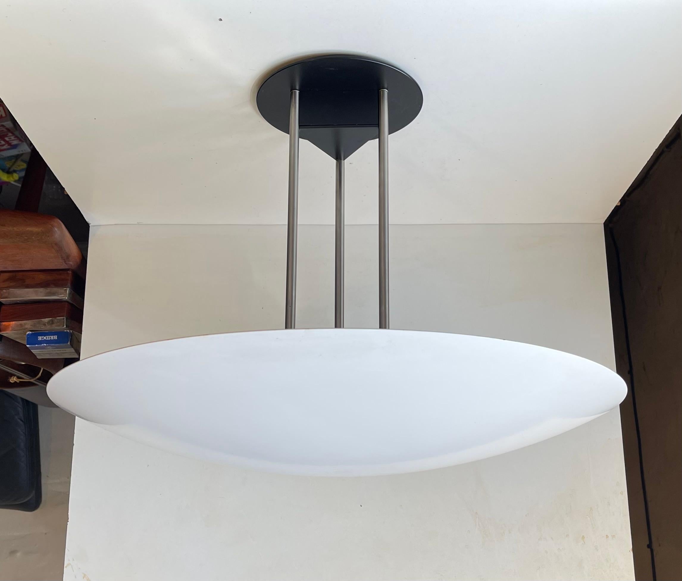 A rare minimalist fixed ceiling lamp or flush mount. It is called Gino and was designed in the late 1970s by Hans Agne Jakobsen, Bjarne Frost and Ole Jespersen. This example from Nordisk Solar in Denmark was made during the 1980s. Measurements: