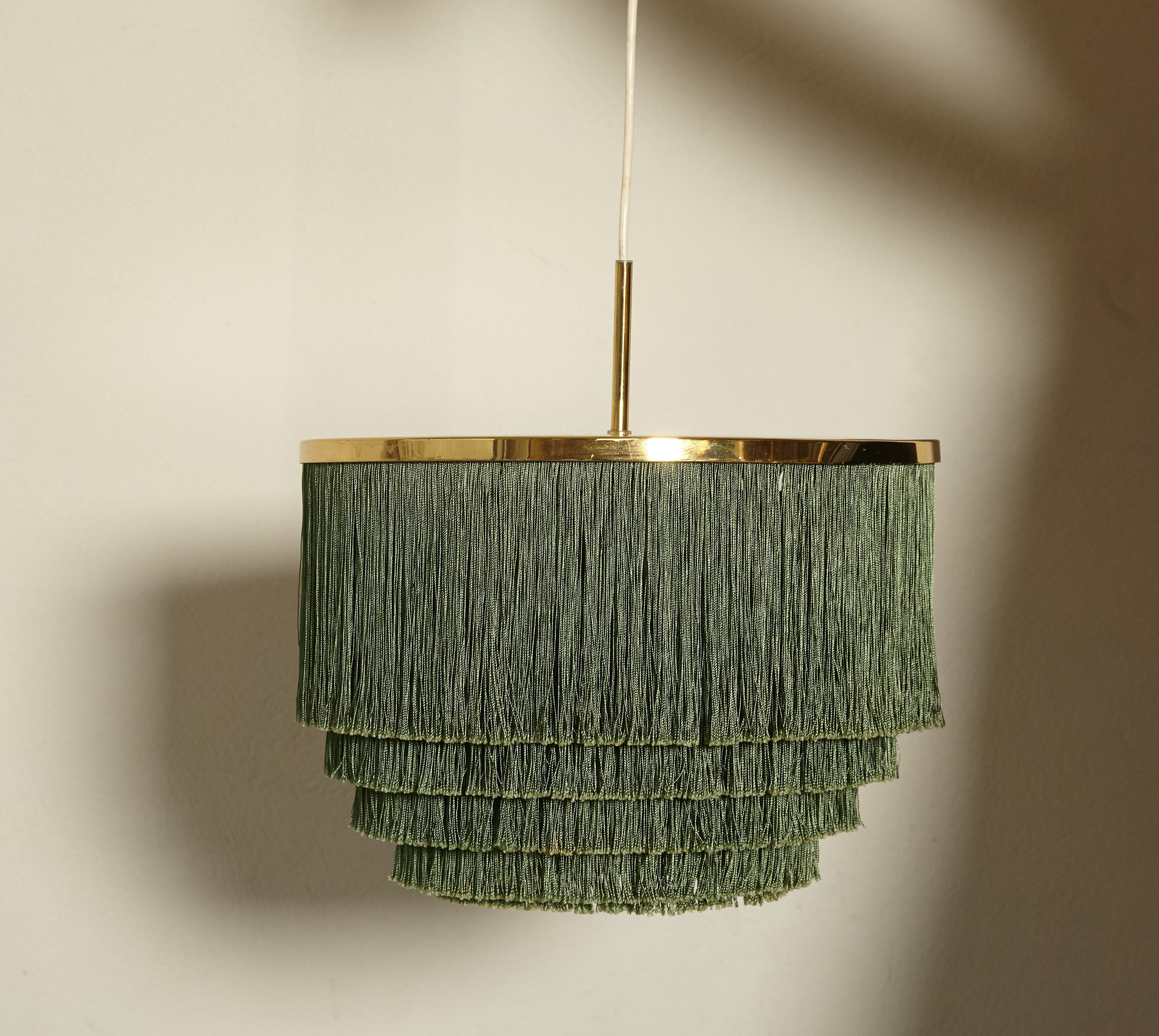 Hans-Agne Jakobsson brass and green silk fringed pendant lamp, Sweden, 1960s. Very good original condition, and a fantastic rare color. Produced by his own company Markaryd in Sweden. With original ceiling mount in brass.