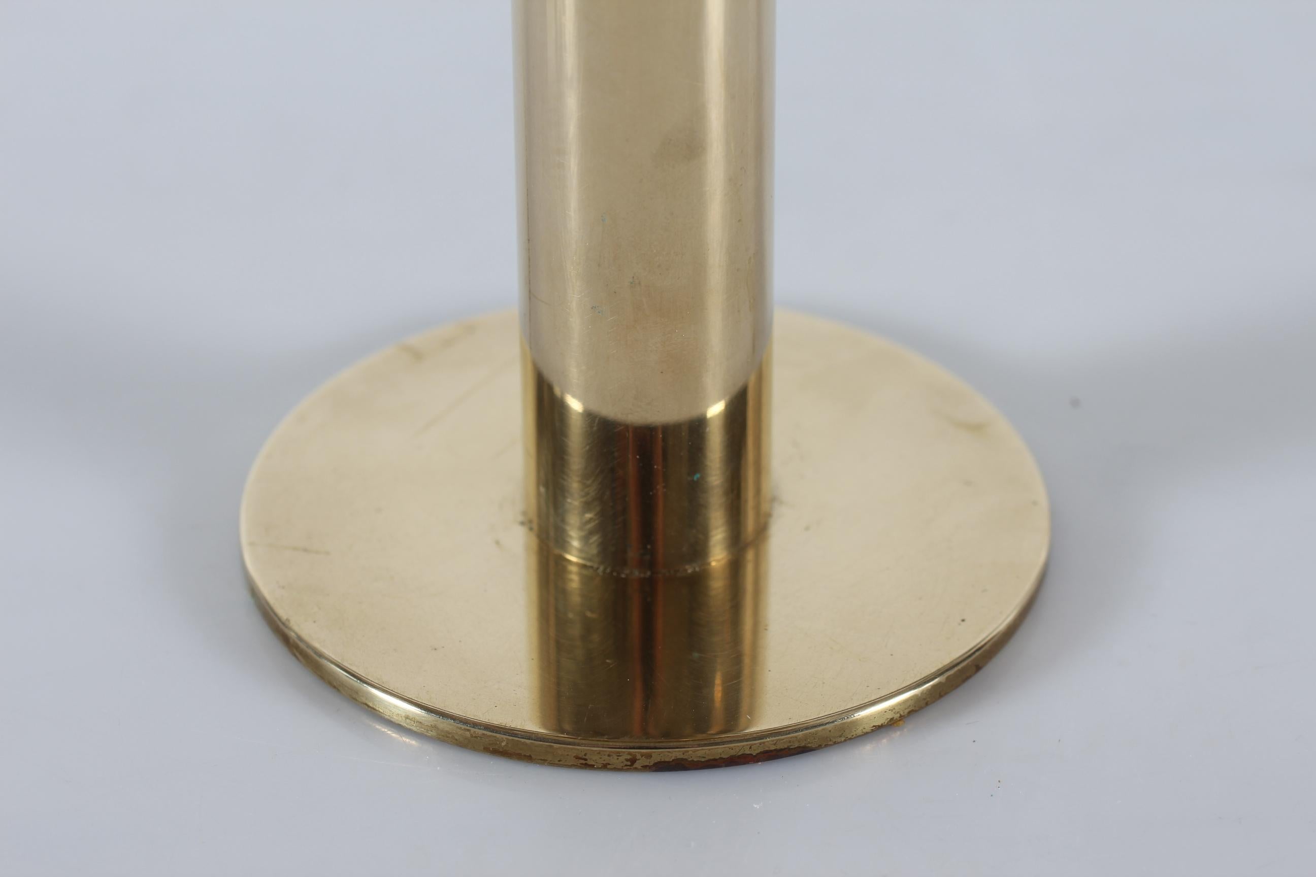 Hans Agne Jakobsson hurricane candle holder model no. L102/32.
The hurricane is made of solid brass with a mouth blown smoke colored glass globe.
Made by Hans Agne Jakobsson A/B in Markaryd, Sweden in the 1960s.
The candle is placed inside the