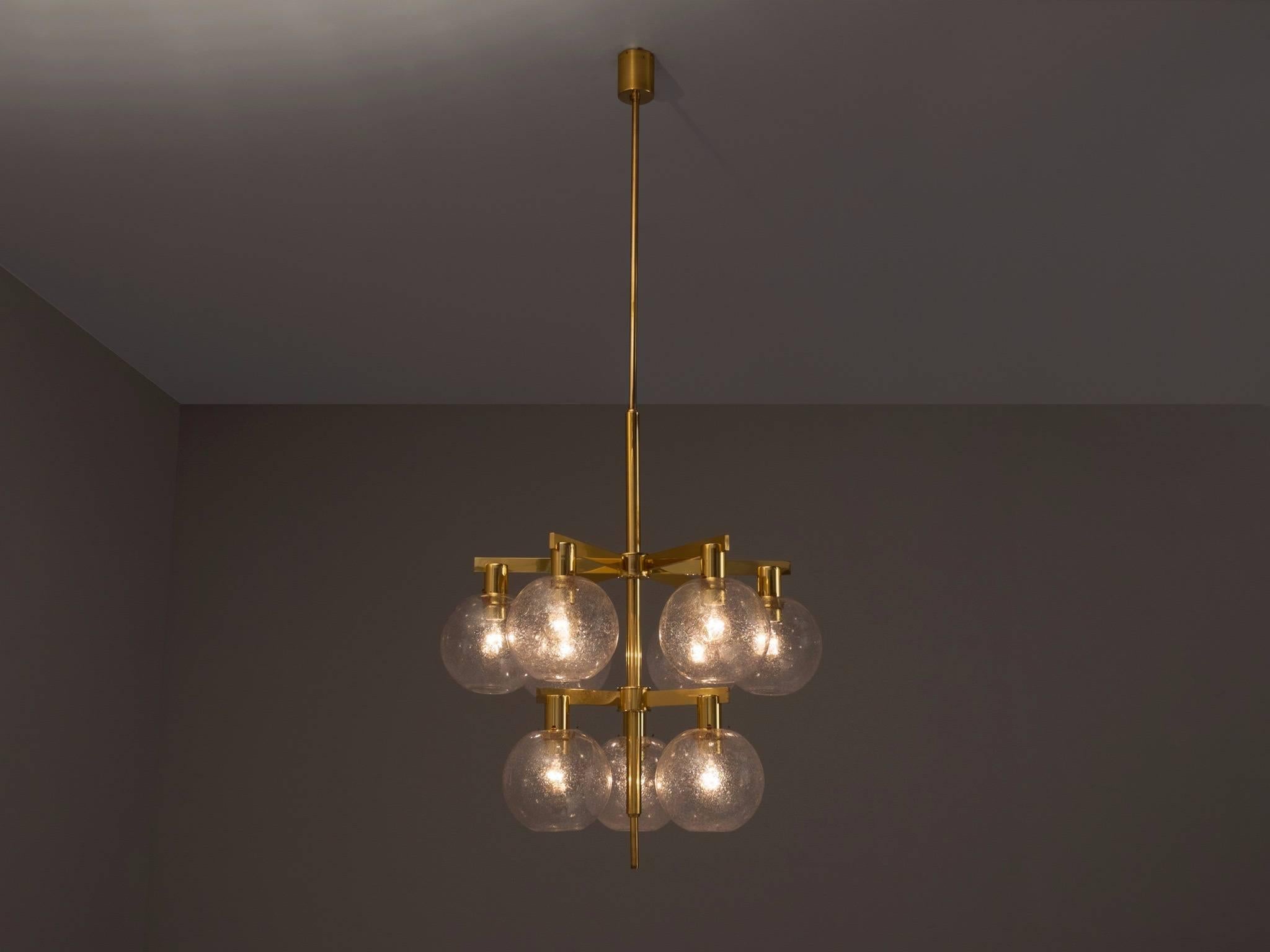 Hans-Agne Jakobsson for Markaryd, chandelier, metal and glass, Sweden, 1960s.

Large Swedish brass chandelier with nine well made transparent glass orbs which are well made with a small 'bubble' pattern within the glass, which provide a very ambient