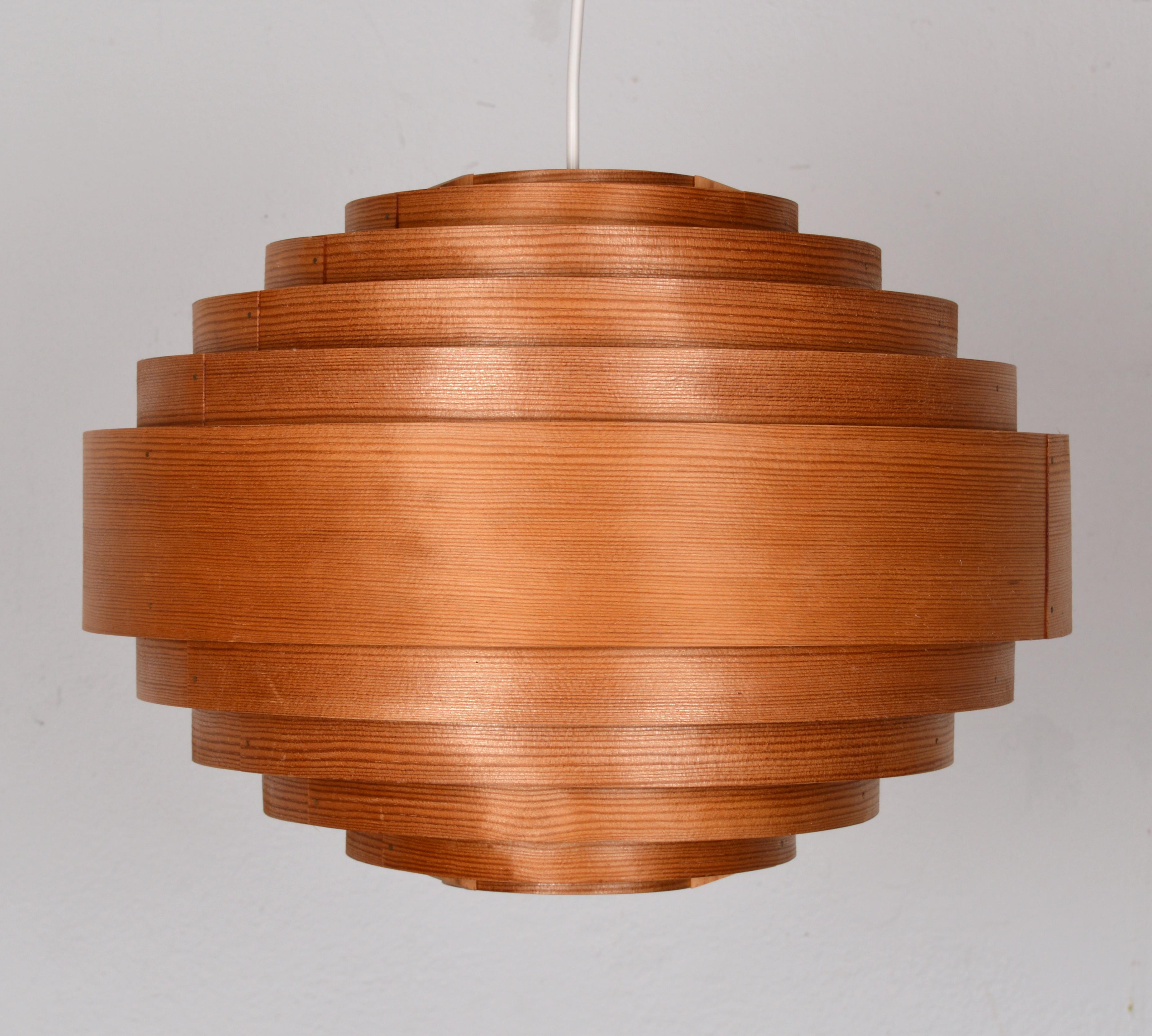 Large 1960s Hans-Agne Jakobsson for Ellysett Pine Chandelier. This is a rare chandelier designed by Hans Agne Jakobsson for Ellysett. This piece is made of pine veneer in a stepped spherical design. This piece has a natural, warm glow when