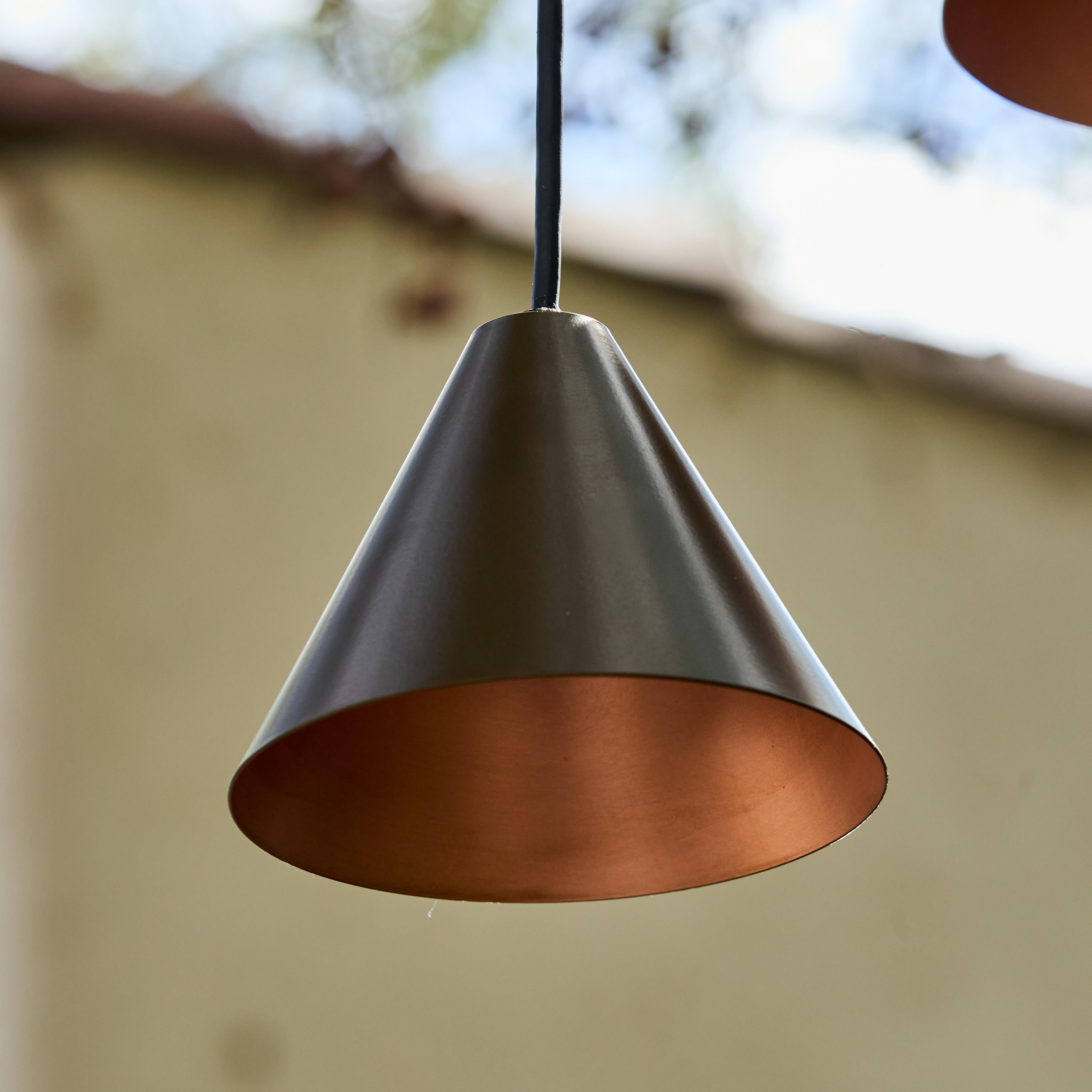 Hans-Agne Jakobsson 'Mini-Tratten' Outdoor Pendant in Bronze

An exclusive made for U.S. and UL listed authorized re-edition of the classic Swedish design from Jakobsson, executed in bronze-colored painted metal with a burnished interior finish. An
