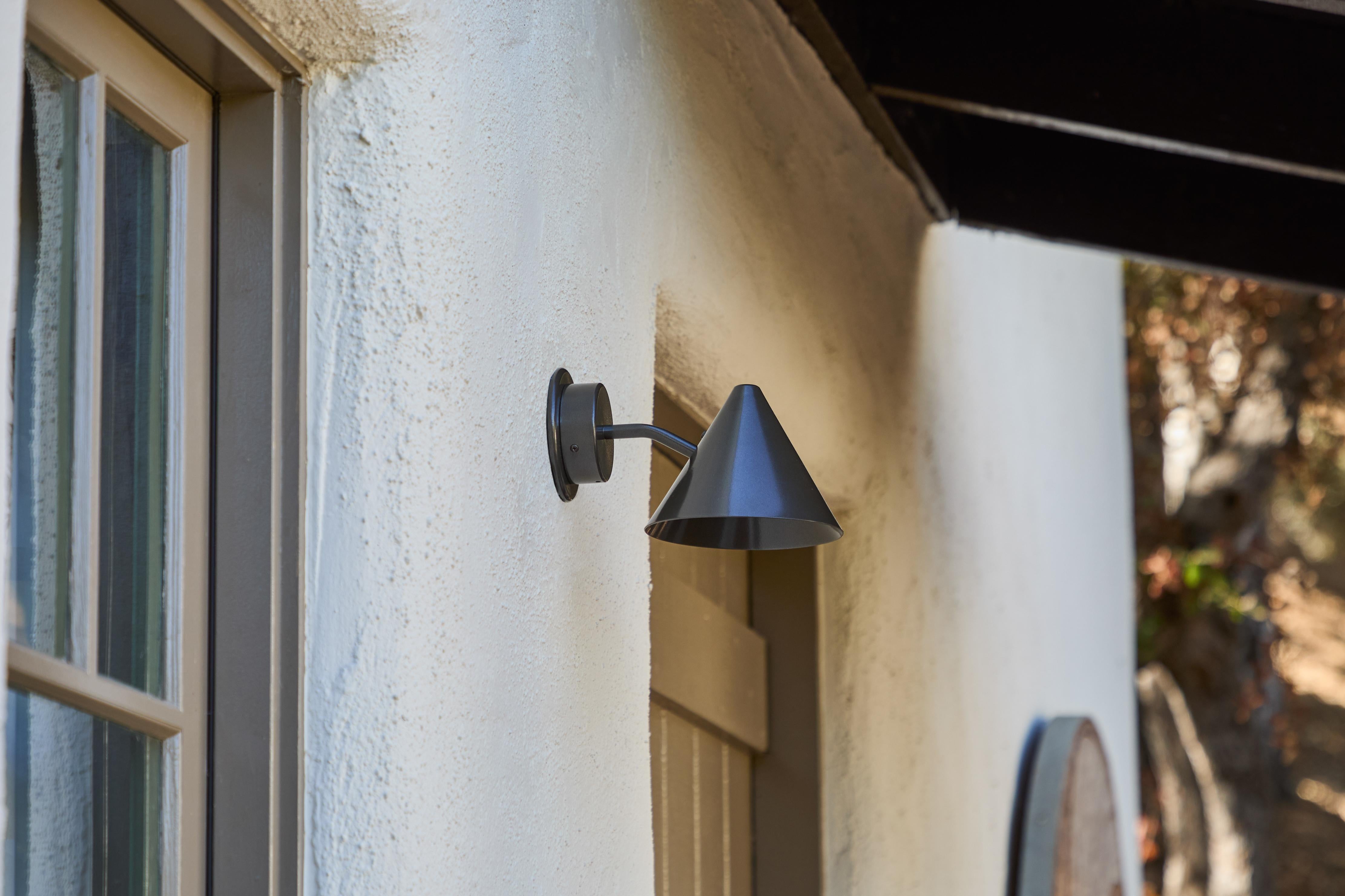 Hans-Agne Jakobsson 'Mini-Tratten' outdoor sconce in painted bronze.  

An exclusive made for U.S. and UL listed authorized smaller-scale re-edition of the classic Swedish design is executed in a painted metal shade with white painted interior and