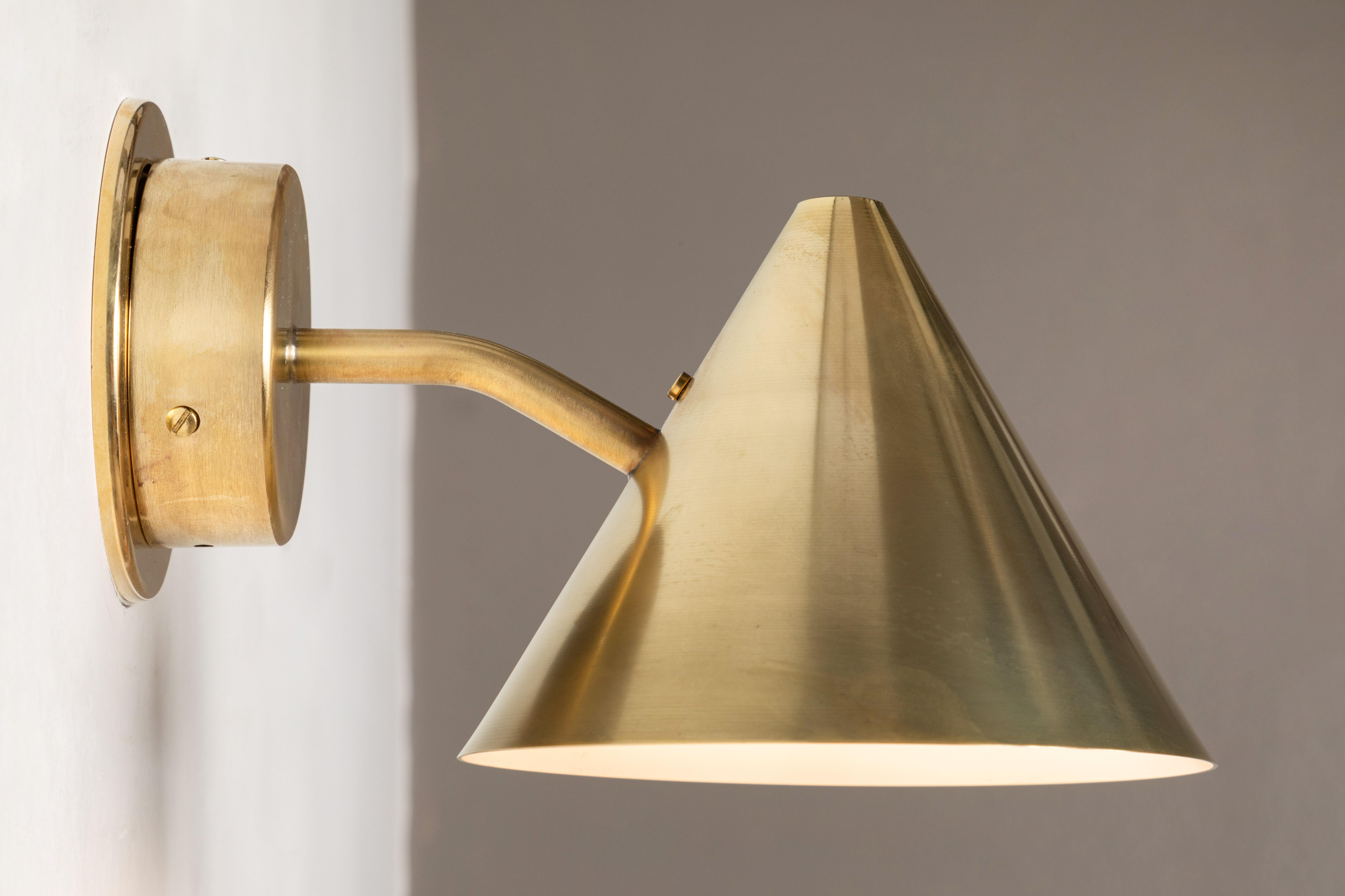 Hans-Agne Jakobsson 'Mini-Tratten' polished brass outdoor sconce. An exclusive made for U.S. and UL listed authorized re-edition of the classic Swedish design executed in hand-polished brass with a white painted interior. An incredibly refined