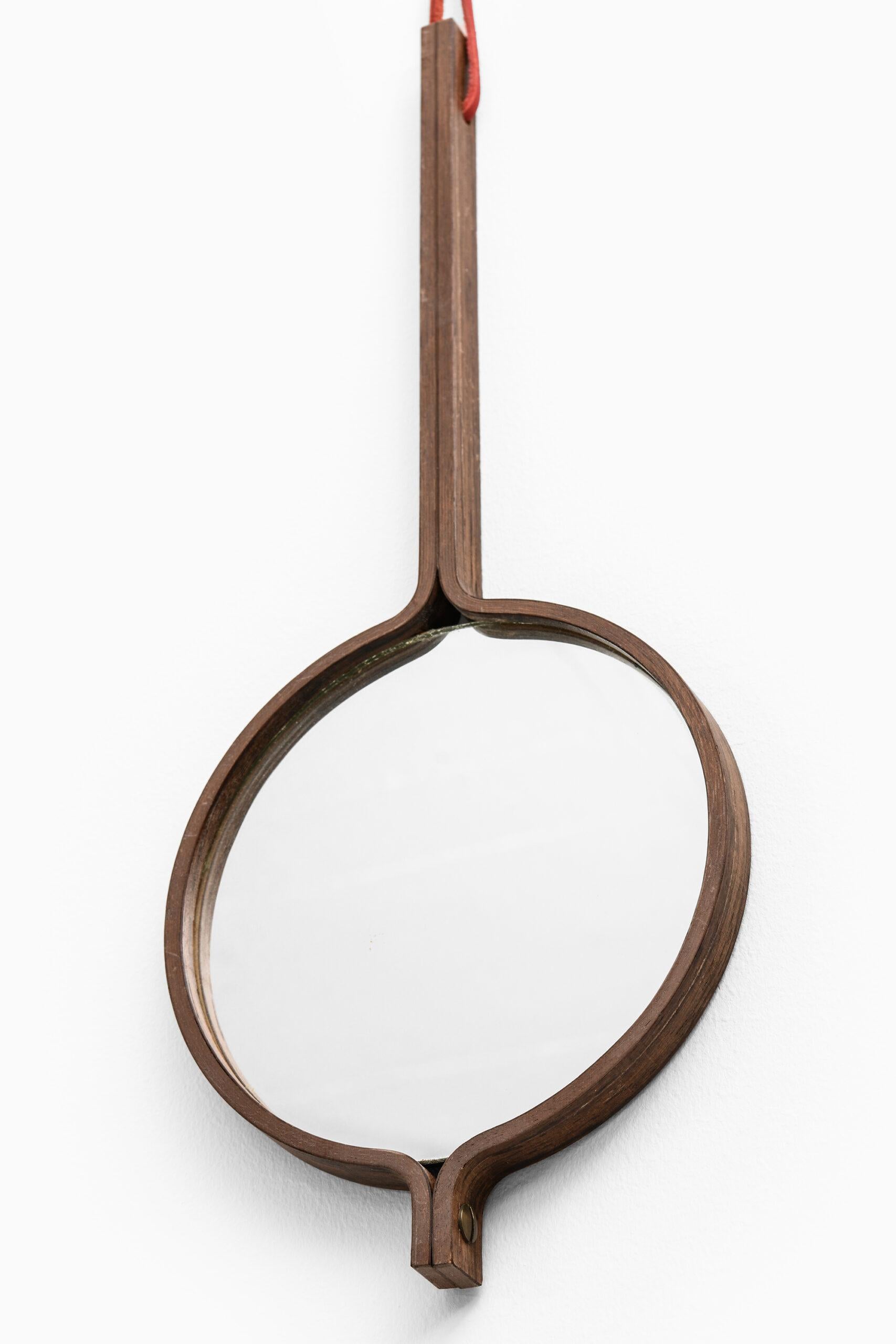 Rare mirror / hand mirror designed by Hans-Agne Jakobsson. Produced by Hans-Agne Jakobsson in Markaryd, Sweden.