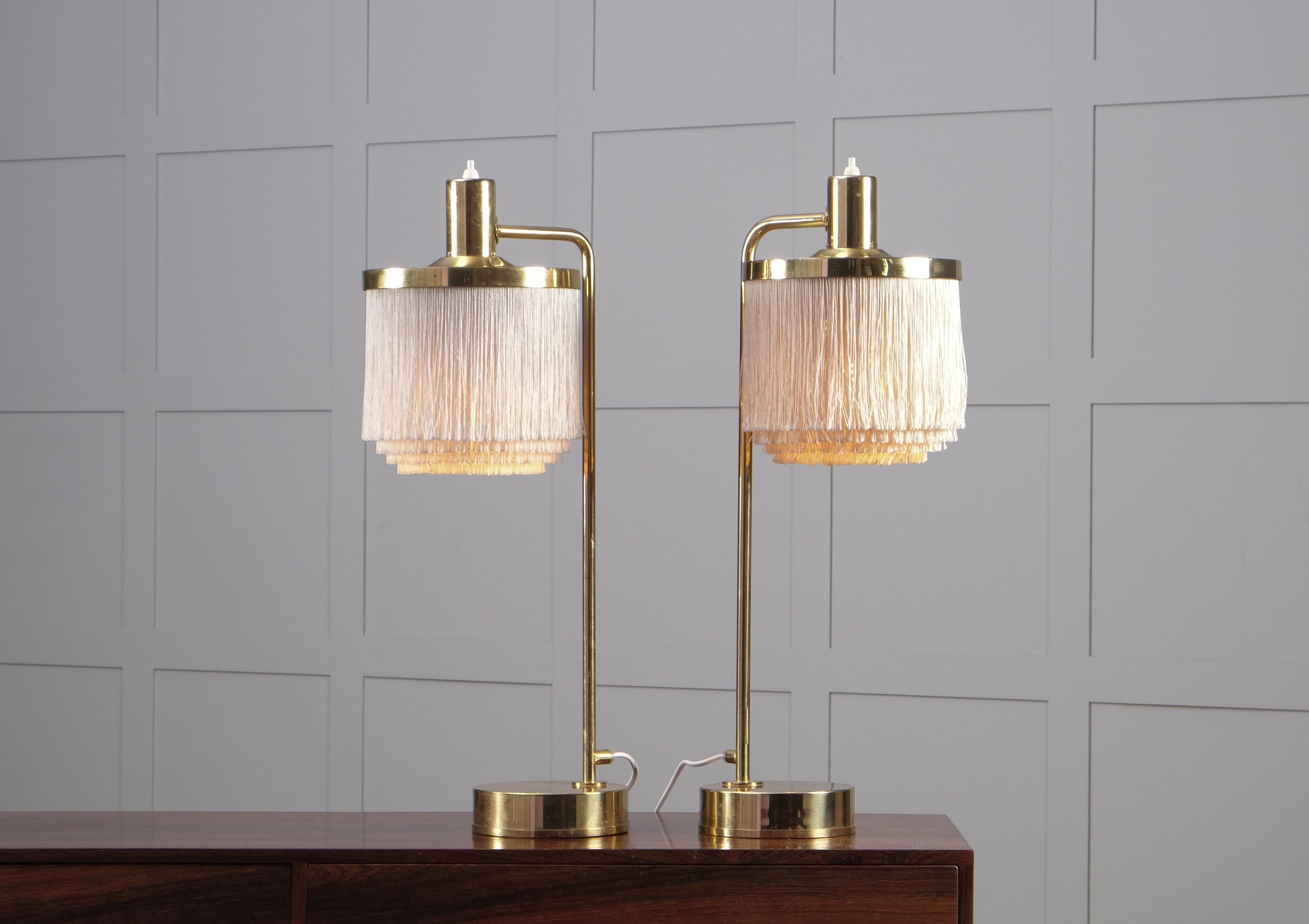 Pair of cream white table lamps produced by Hans-Agne Jakobsson in Markaryd, Sweden.
New wiring.