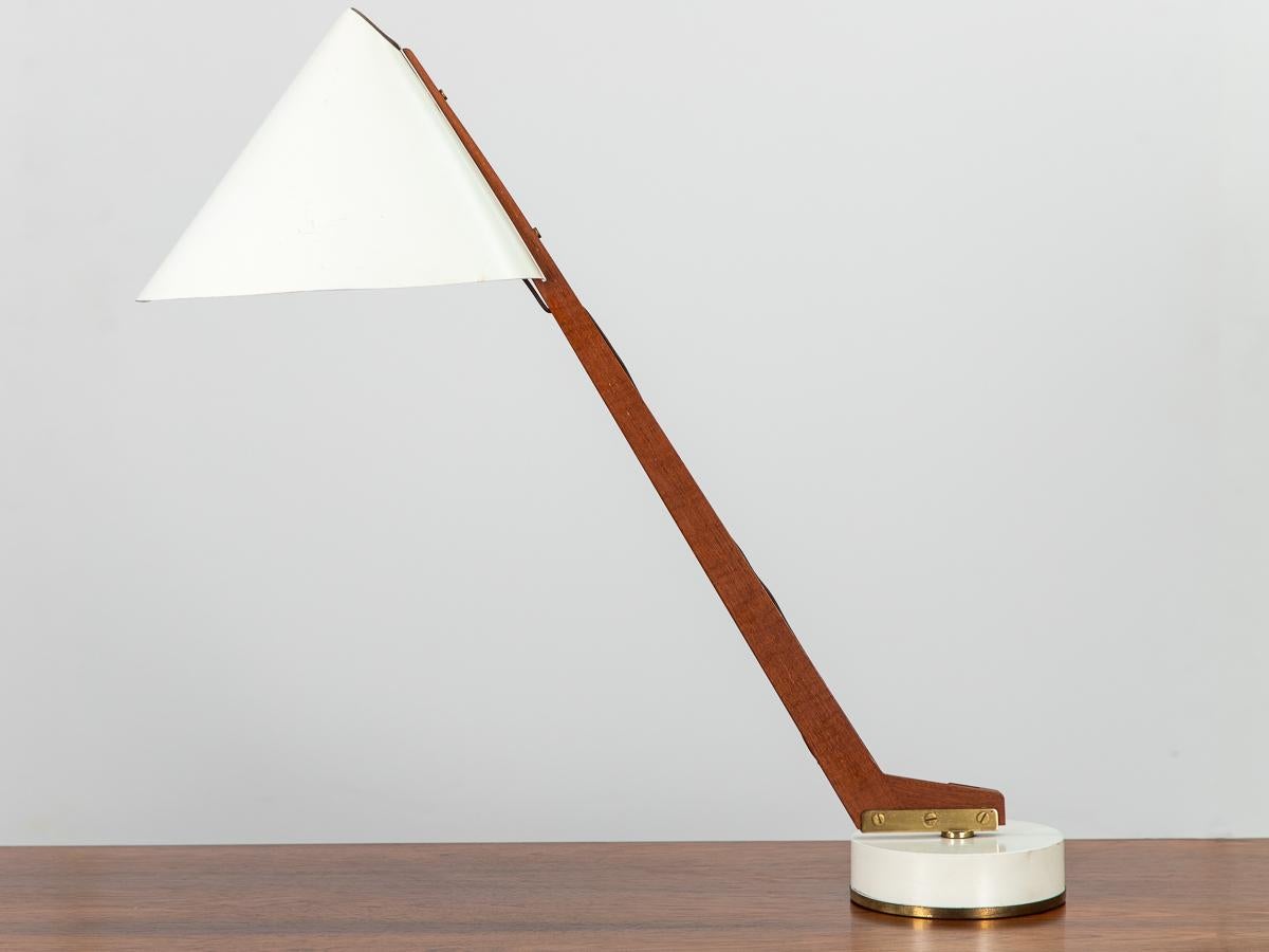 Model B-54 Articulating Table Lamp, designed by Hans Agne Jakobsson for his company Markaryd. An elegant design, outfitted with chic and polished brass hardware. Highly functional, this desk lamp emits downcast illumination from the conical enamel