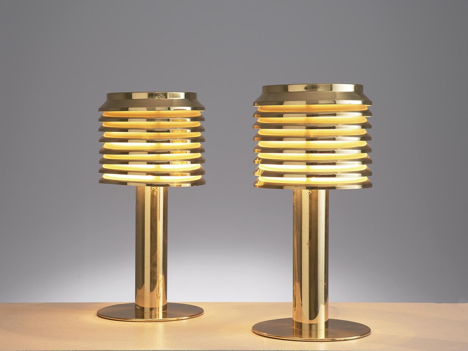 Hans-Agne Jakobsson, pair of table lamps model B-142, brass, Sweden 1960s.

Luxurious pair of table lights, designed by the Swedish master of light; Hans-Agne Jakobsson. This model, called B-142, features a brass foot that holds a brass shade. The