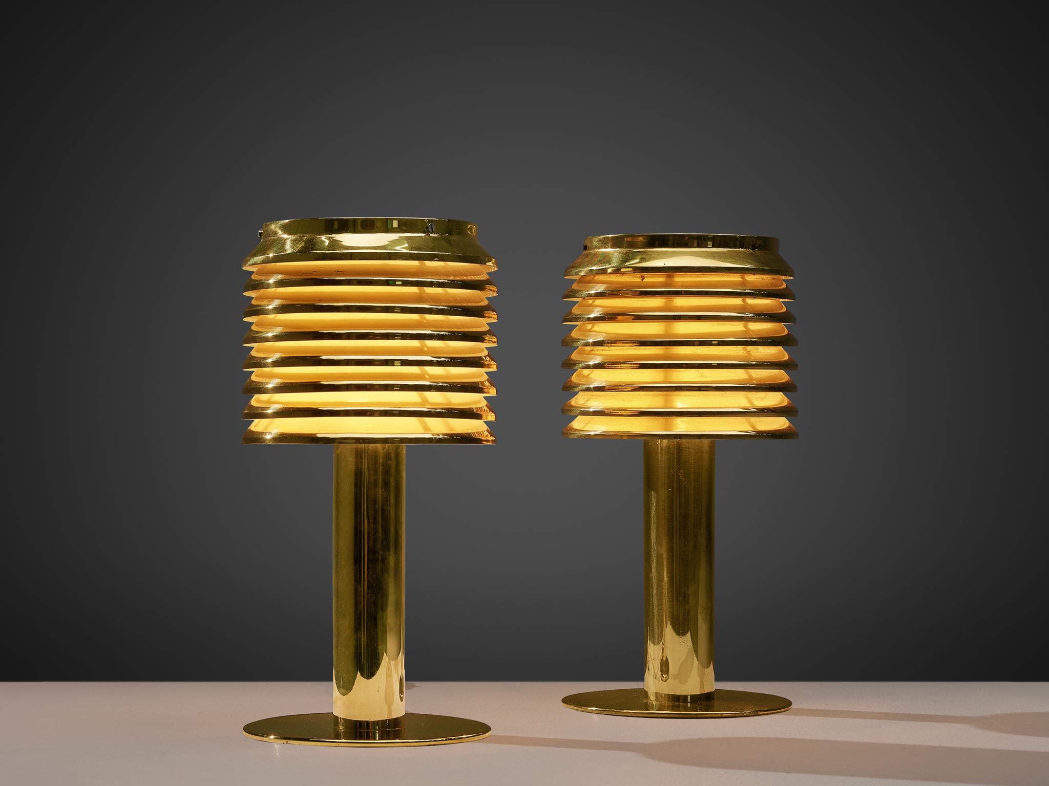 Hans-Agne Jakobsson, pair of table lamps model B-142, brass, Sweden, 1960s

Luxurious pair of table lights, designed by the Swedish master of light Hans-Agne Jakobsson. This model, called B-142, features a brass foot that holds a brass shade. The