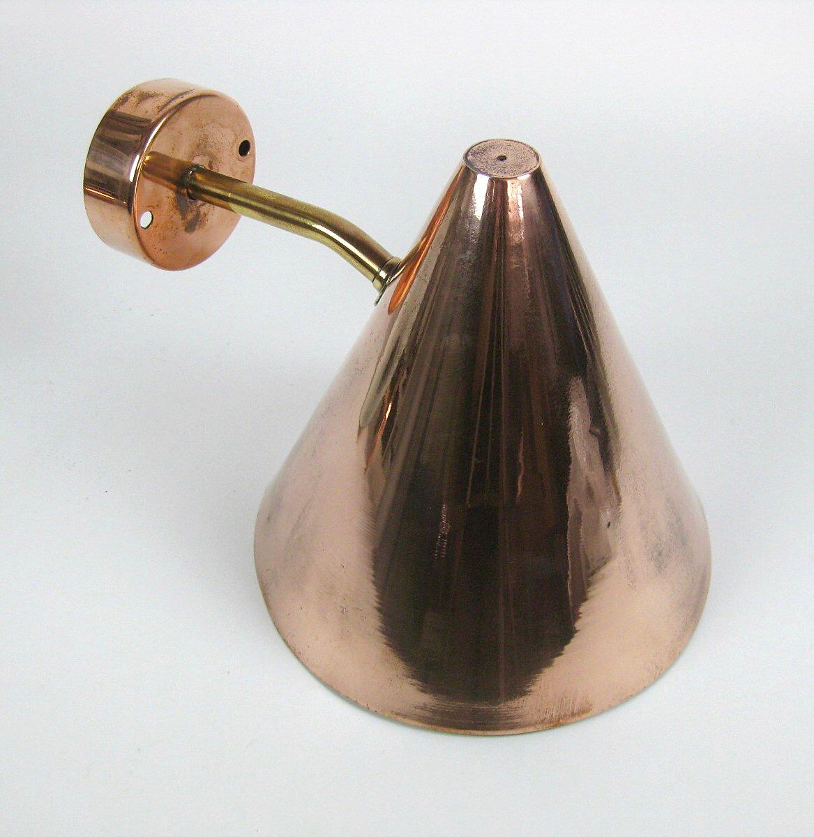 Hans-Agne Jakobsson for AB Markaryd, set of wall lights, shade in polished copper and brass arm, made in Sweden, 1950s. Marked with original labels.