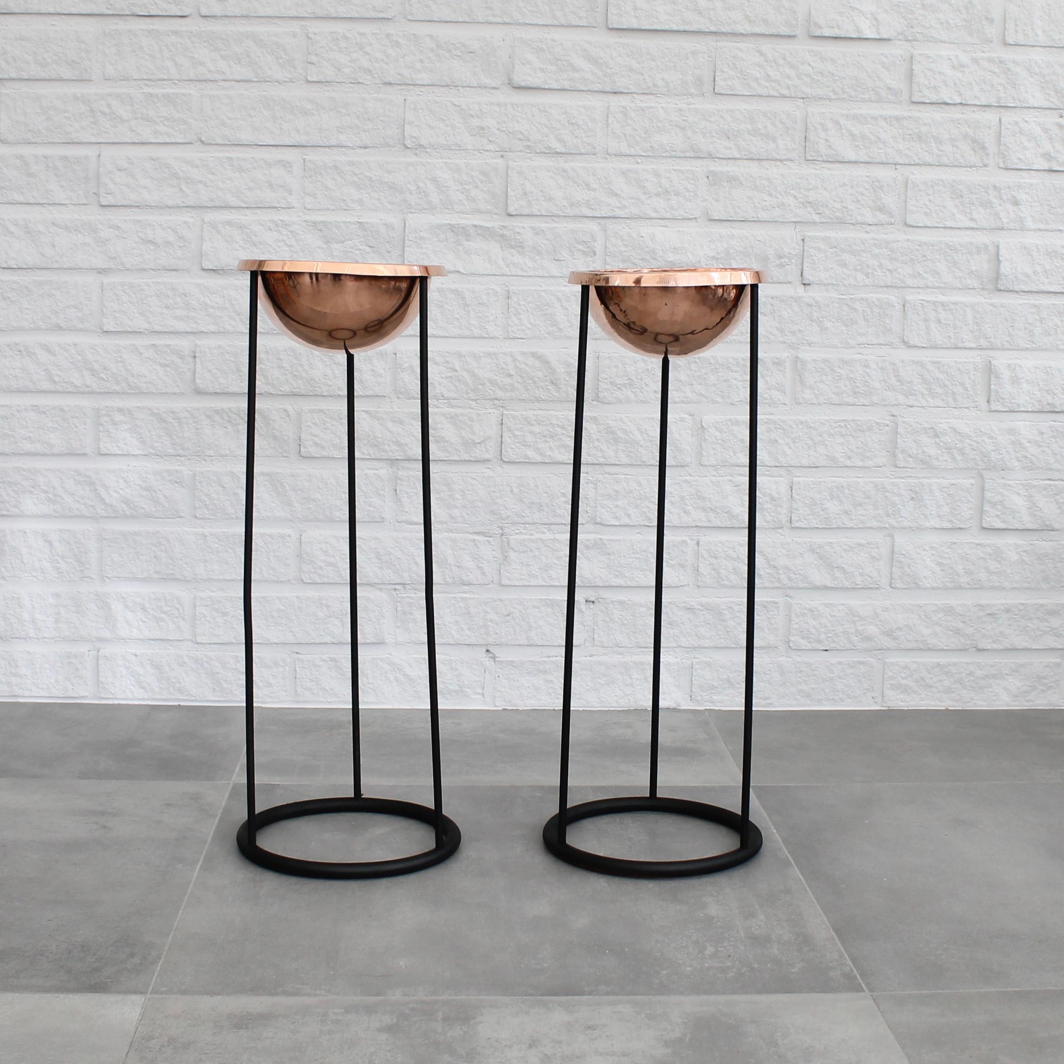A pair of floor-standing ashtrays, model C34 by Hans-Agne Jakobsson AB in Markaryd, Sweden, dating back to the 1950s/60s. These feature a black metal frame with dome-shaped copper ashtrays. Can also be used as planters or bowls. Swedish industrial