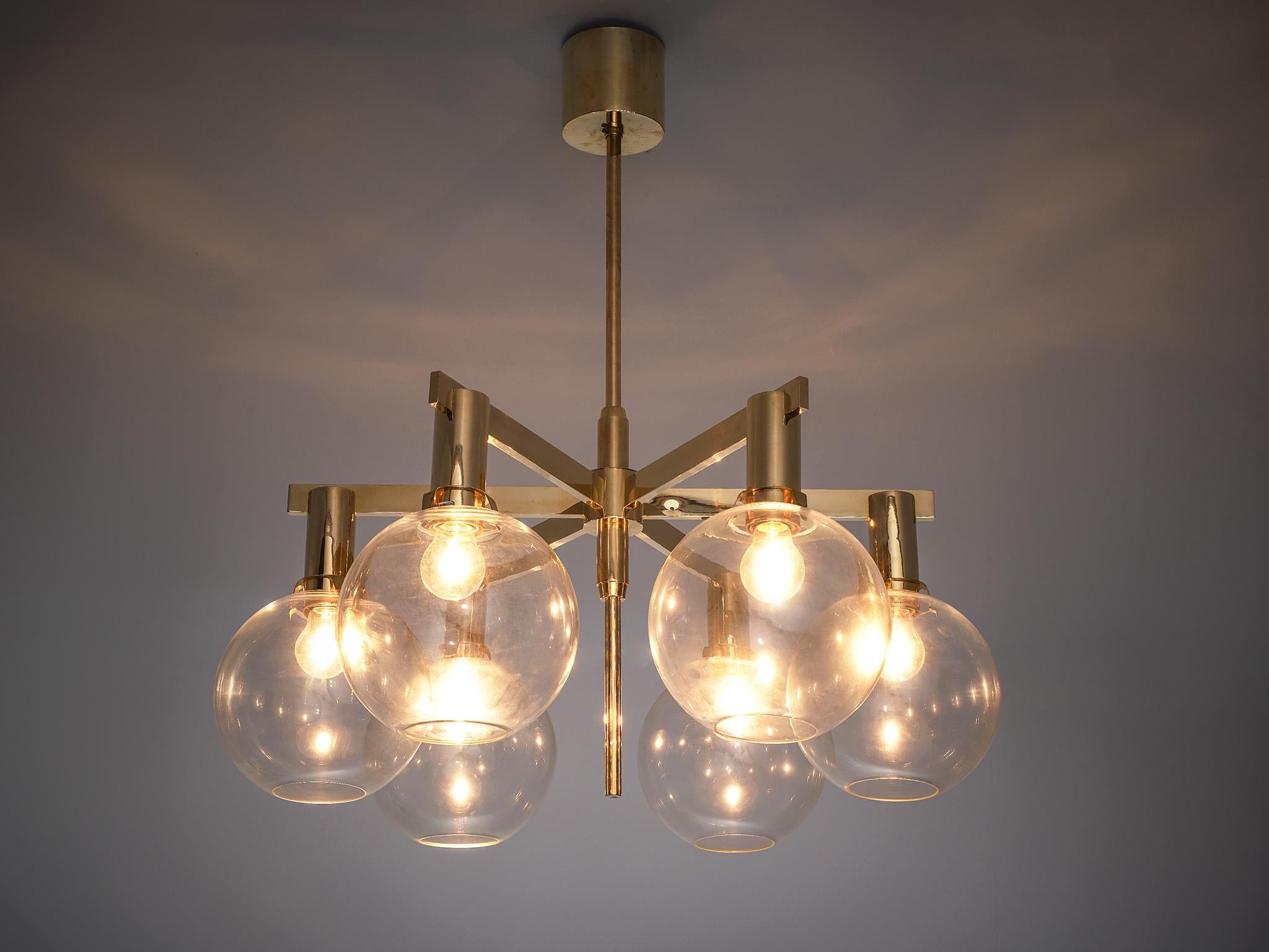 Hans-Agne Jakobsson, ceiling lamp model T-348/6 'Pastoral', brass and glass, Sweden, 1950s.

This chandelier is designed by Hans-Agne Jakobsson and produced by Hans-Agne Jakobsson AB in Markaryd, Sweden. The brass frame has six brass tubes that