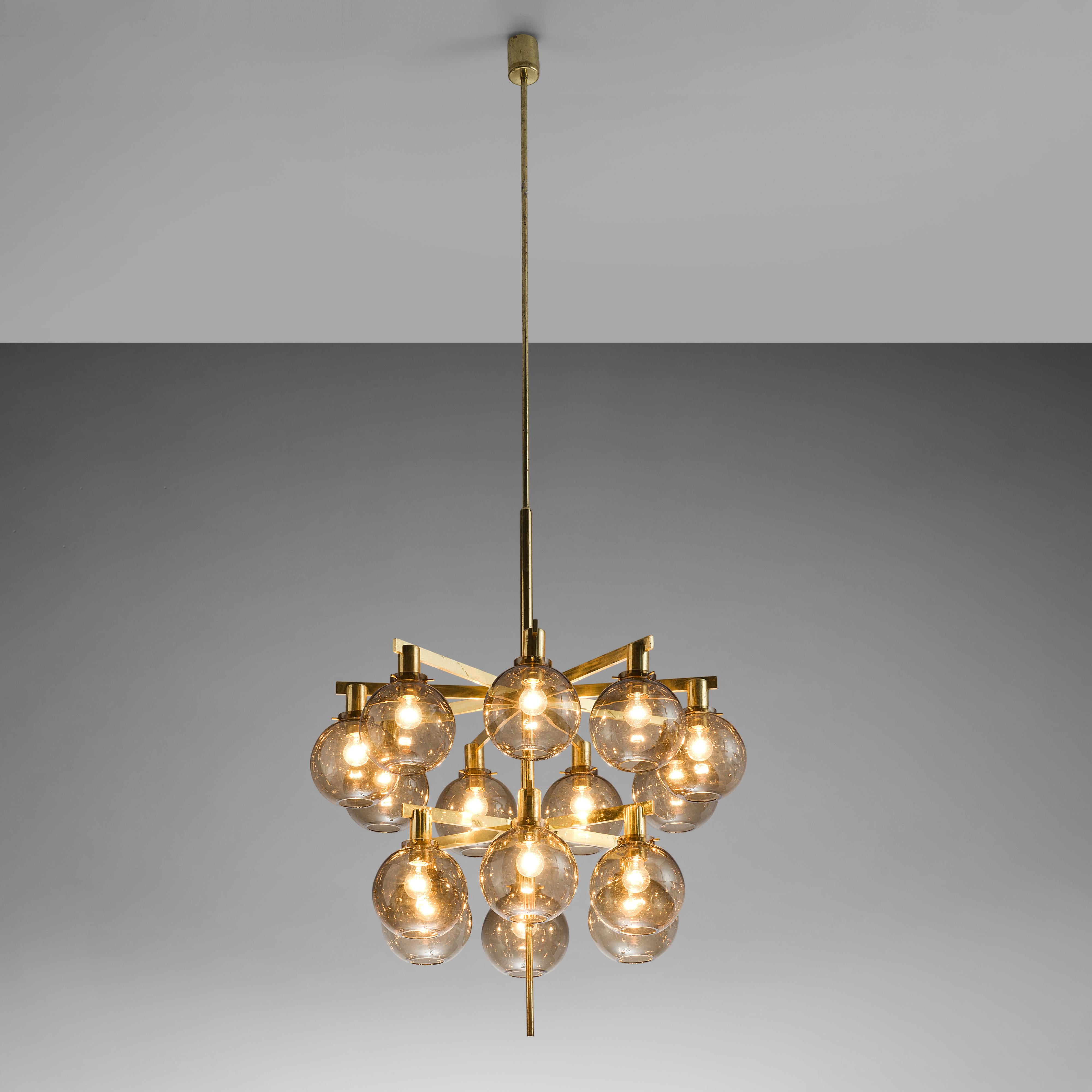 Hans-Agne Jakobsson, ‘Pastoral’ chandelier model T-348/6, brass, glass, Sweden, 1960s

This ceiling lamp model T348/15 called 'Pastoral' is designed by Hans-Agne Jakobsson. Multiple glass spheres are arranged in circles on two levels. The soft