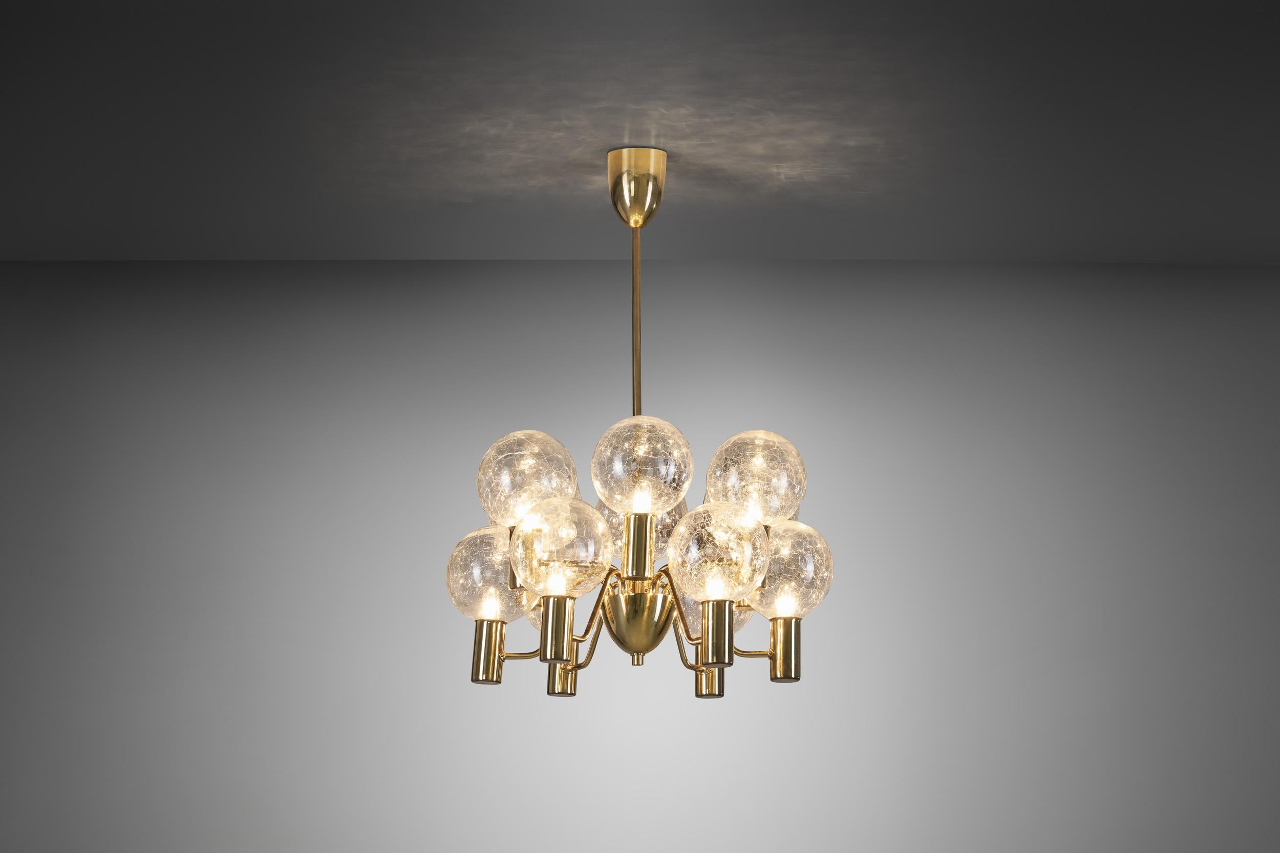 This marvellous, brass twelve-light chandelier was created in what we now call “the golden age of Scandinavian design”. Hans-Agne Jakobsson was the great Swedish master of lighting, designing some of the most recognizable mid-century modern lamps of
