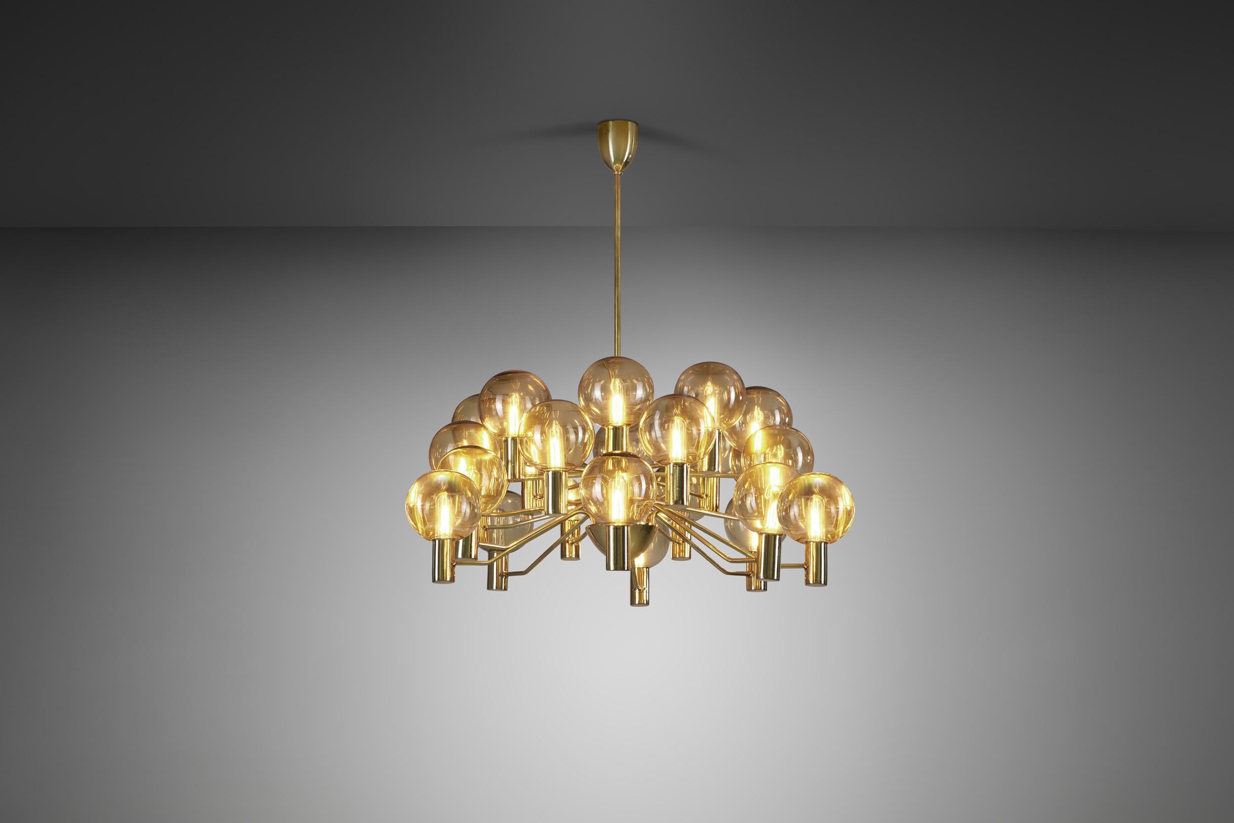 This marvellous, brass twelve-light chandelier was created in what we now call “the golden age of Scandinavian design”. Hans-Agne Jakobsson was the great Swedish master of lighting, designing some of the most recognizable mid-century modern lamps of