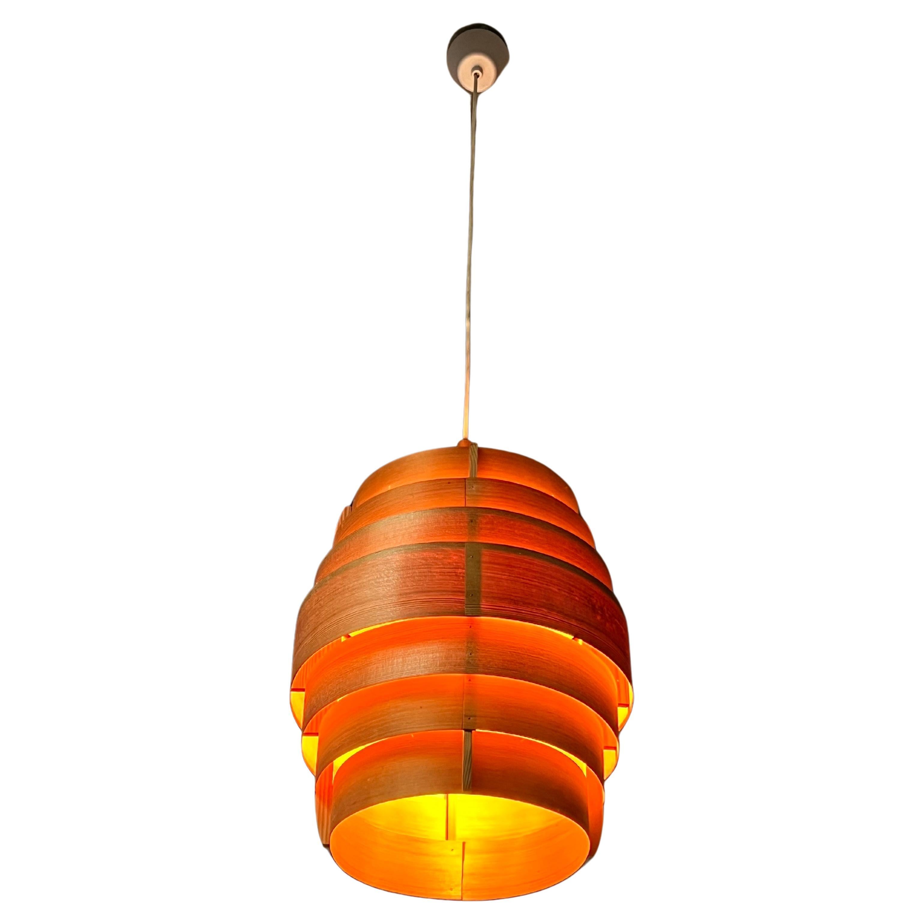 Big model pine suspension from the 1950's by Swedish master of lighting Hans Agne Jakobsson. The lamp provide a warm atmosphere and even better when lighted. Made of thin stripes of pine delicately nailed to a minimal pine frame. Working condition.