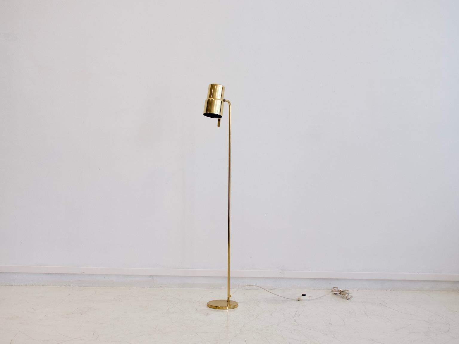 Polished brass floor light designed by Hans-Agne Jakobsson and manufactured by Markaryd in Sweden. Great vintage condition, minor wear on brass. Labeled by maker.