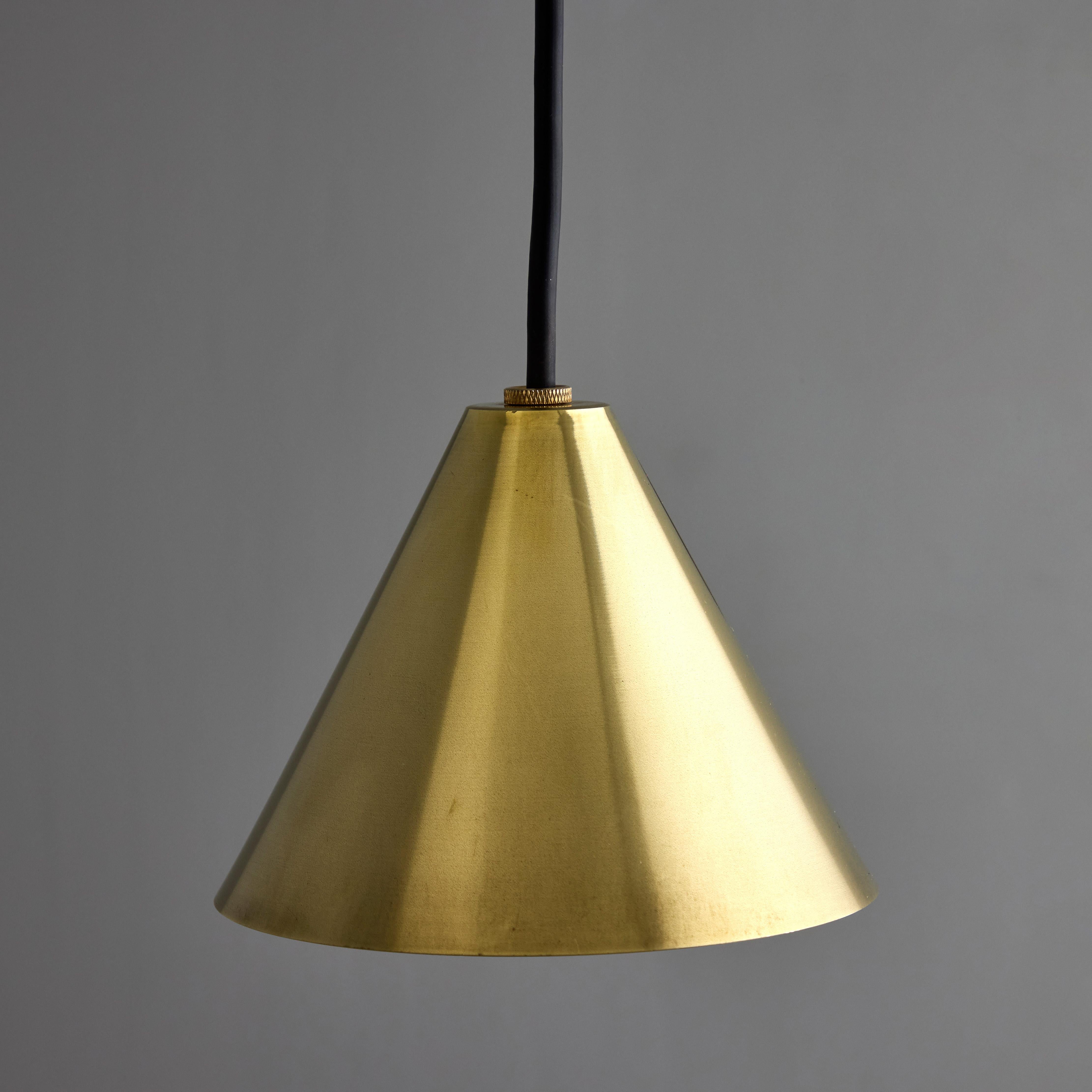 Hans-Agne Jakobsson Polished Brass 'Mini-Tratten' Outdoor Pendant.

An exclusive made for U.S. and UL listed authorized re-edition of the classic Swedish design from Jakobsson, Executed in raw unlacquered polished brass with a burnished interior