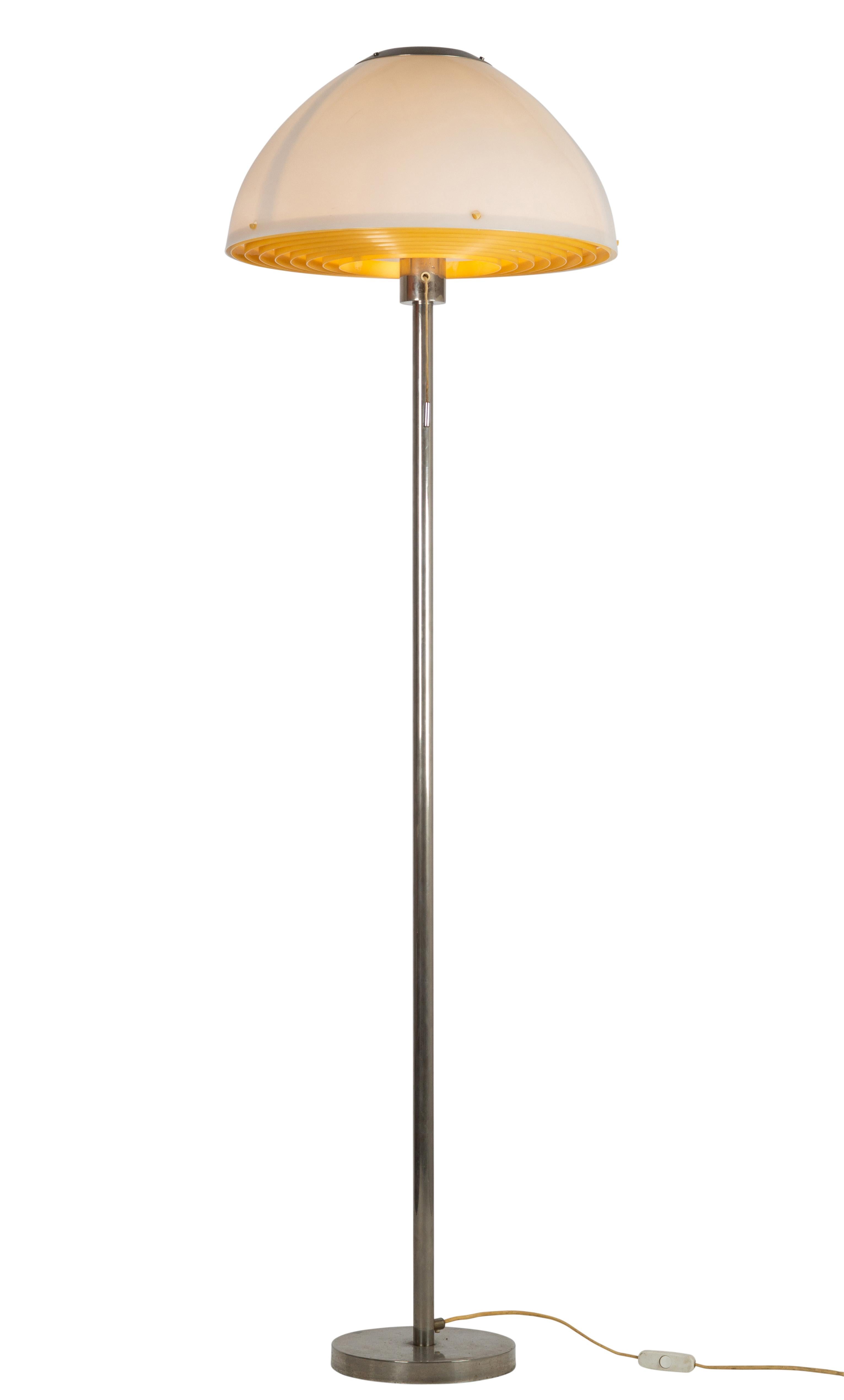 Hans-Agne Jakobsson Rare floor lamp, very hard to find. Metal base with a acrylic shade. There is a circular grid in front of the light, this gives a beautiful and warm light. The lamp has a makers stamp on the top of the fixture.

 