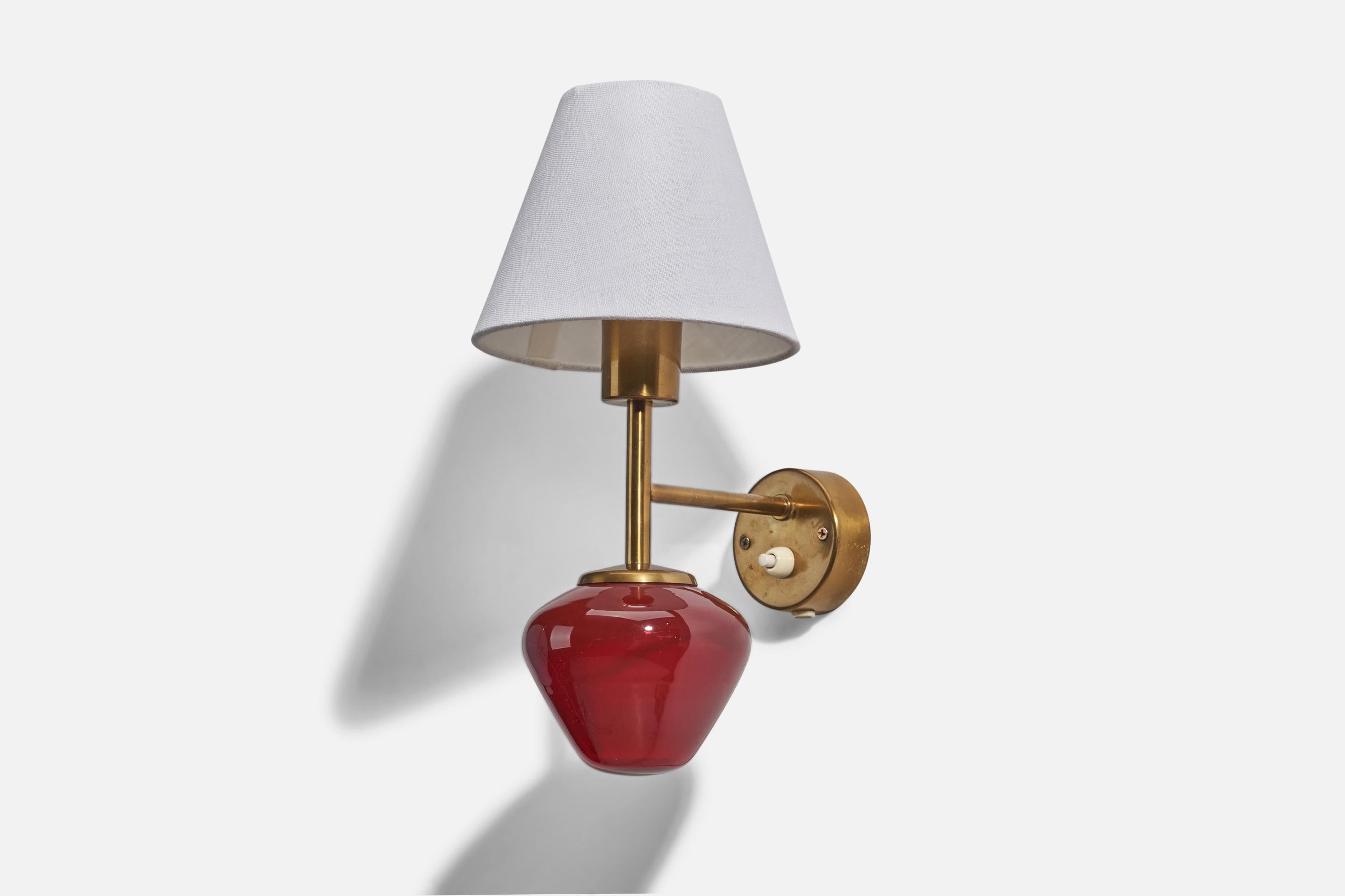 A brass, red glass and white fabric sconce designed and produced by Hans-Agne Jakobsson, Sweden, 1960s.

Sold with Lampshade. Dimensions stated are of Sconce with Lampshade.

Dimensions of Back Plate (inches) : 2.83 x 2.83 x 0.97 (Height x Width x