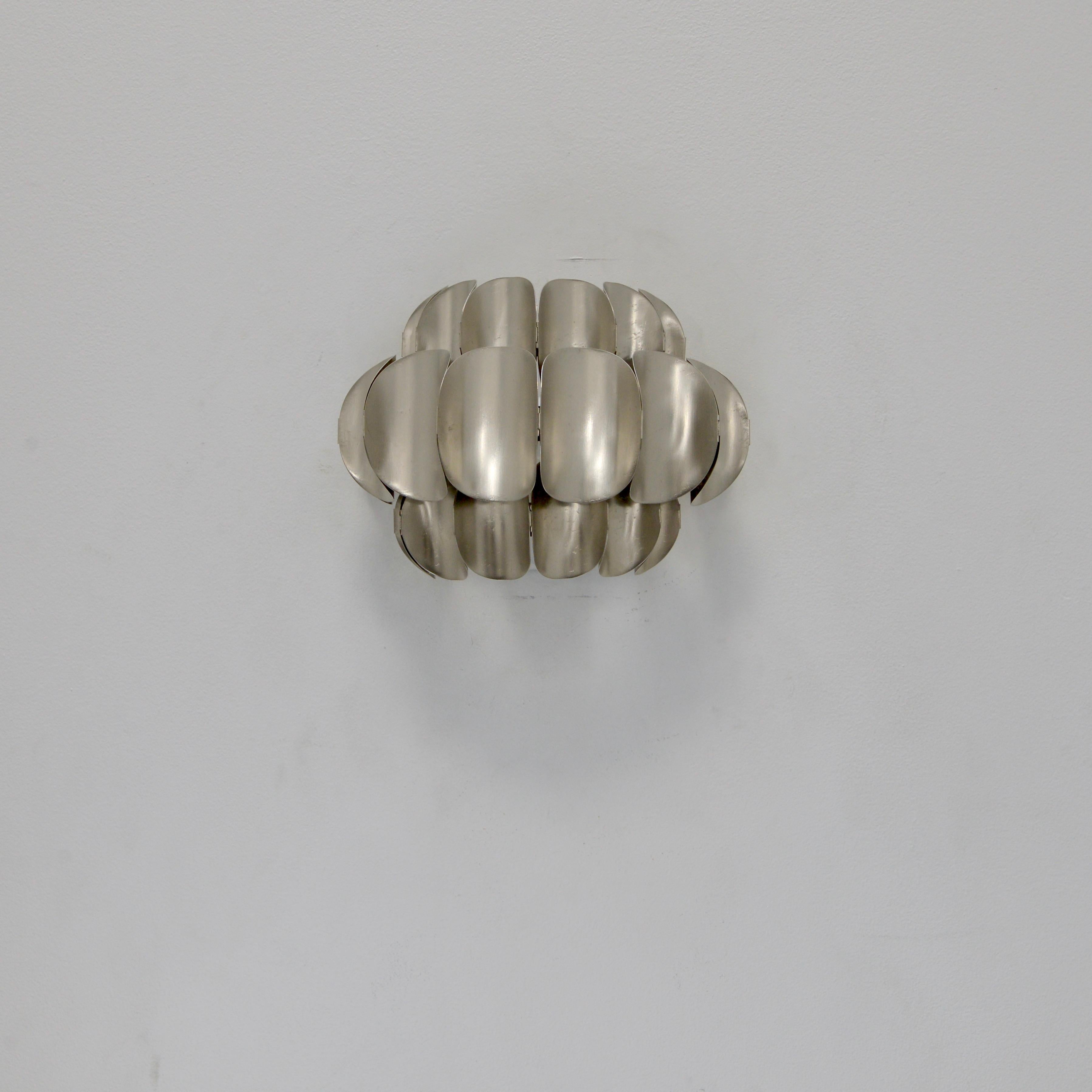 Beautiful nickel-plated steel sconces by Hans-Agne Jakobsson from 1950s Sweden. Partially restored, with original nickel-plated steel finish. Rewired for the US with a single E26 medium based socket per sconce. Lightbulbs included with