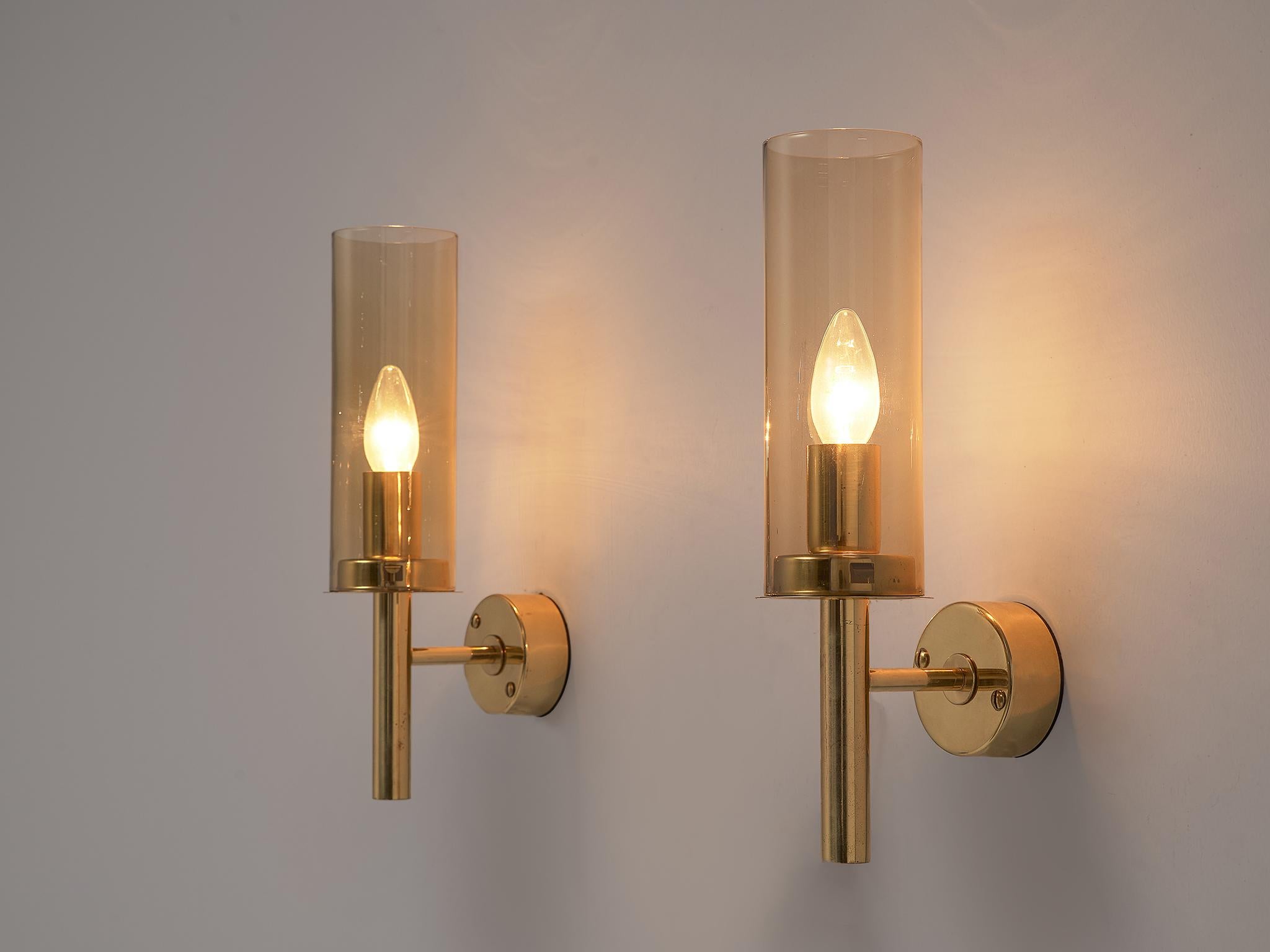 Hans-Agne Jakobsson, pair of wall lights model V-169, brass and glass, Sweden, 1960s.

This set of two brass and glass wall lamps, model V-169 from the 'Sonata' collection, was designed by Hans-Agne Jakobsson in Sweden during the 1960s.
These