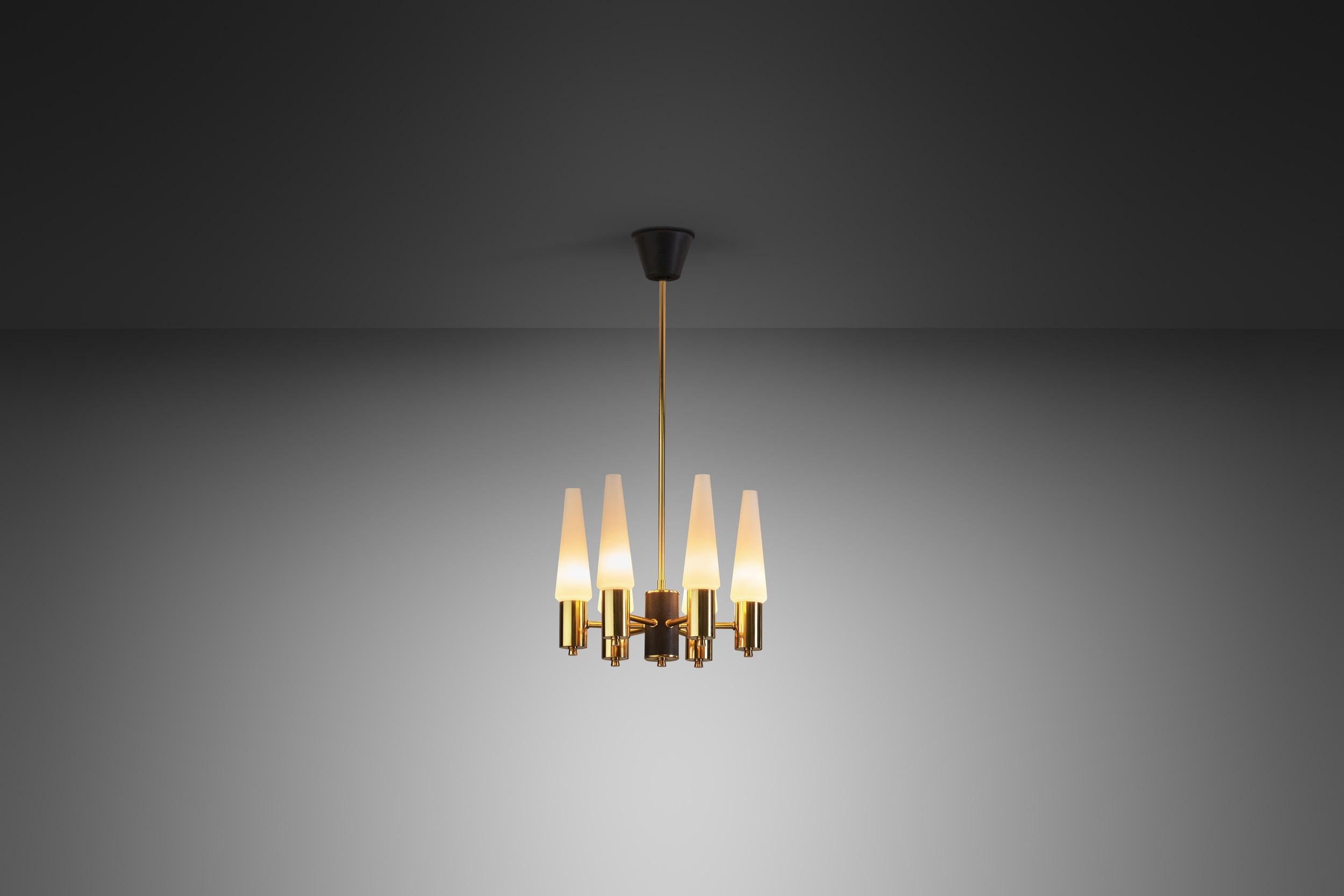 This beautiful chandelier is from the heyday of post-war Modernism, an era that brought Scandinavian design into blossom. The period saw the revival of an elementary, undecorated visual language, emphasizing sleek design as this marvellous, brass