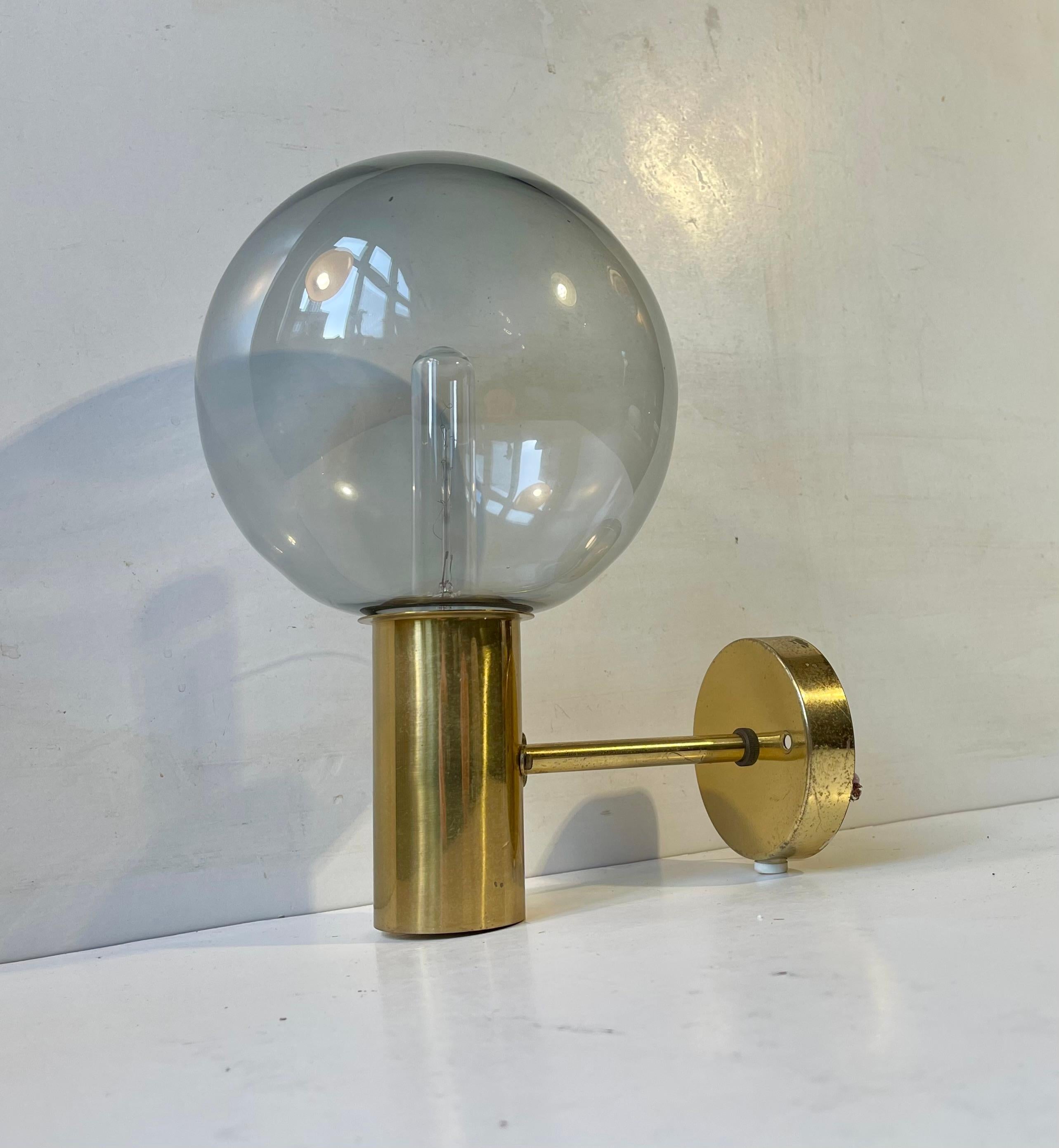 Spherical Glass shaded sconce designed by Hans Agne Jakobsson and manufactured by Markaryd AB in Sweden during the 1960s. This model is called V149 or Soap Bubble. 

Measurements: H/D/diameter: 26x23x15 cm. 

It comes installed with 3 meters new