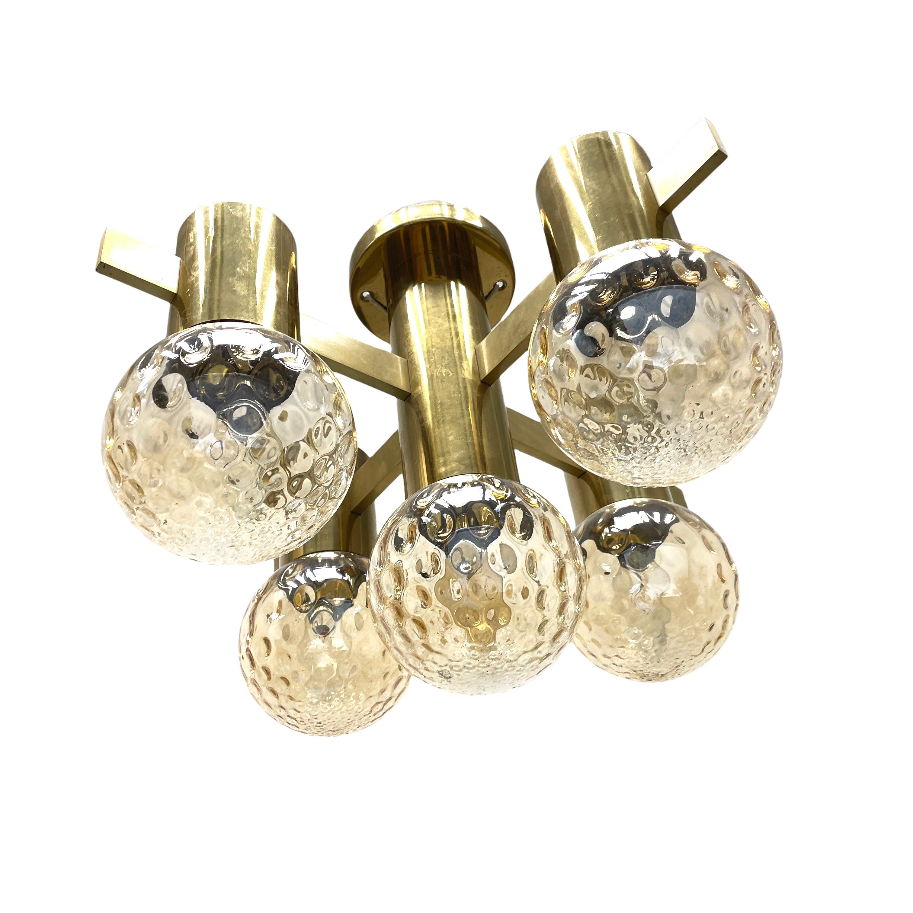 Very decorative and beautiful flush mount made of brass, fitted with five E14 sockets with glass ball shades. Made by Hans Agne Jakobsseon in the 1960s. The fixture requires five European E14 / 110 Volt bulbs, each bulb up to 40 watts. The brass has