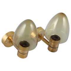 Vintage Hans Agne Jakobsson, Sweden, a Pair of Wall Sconces in Brass and Smoked Glass