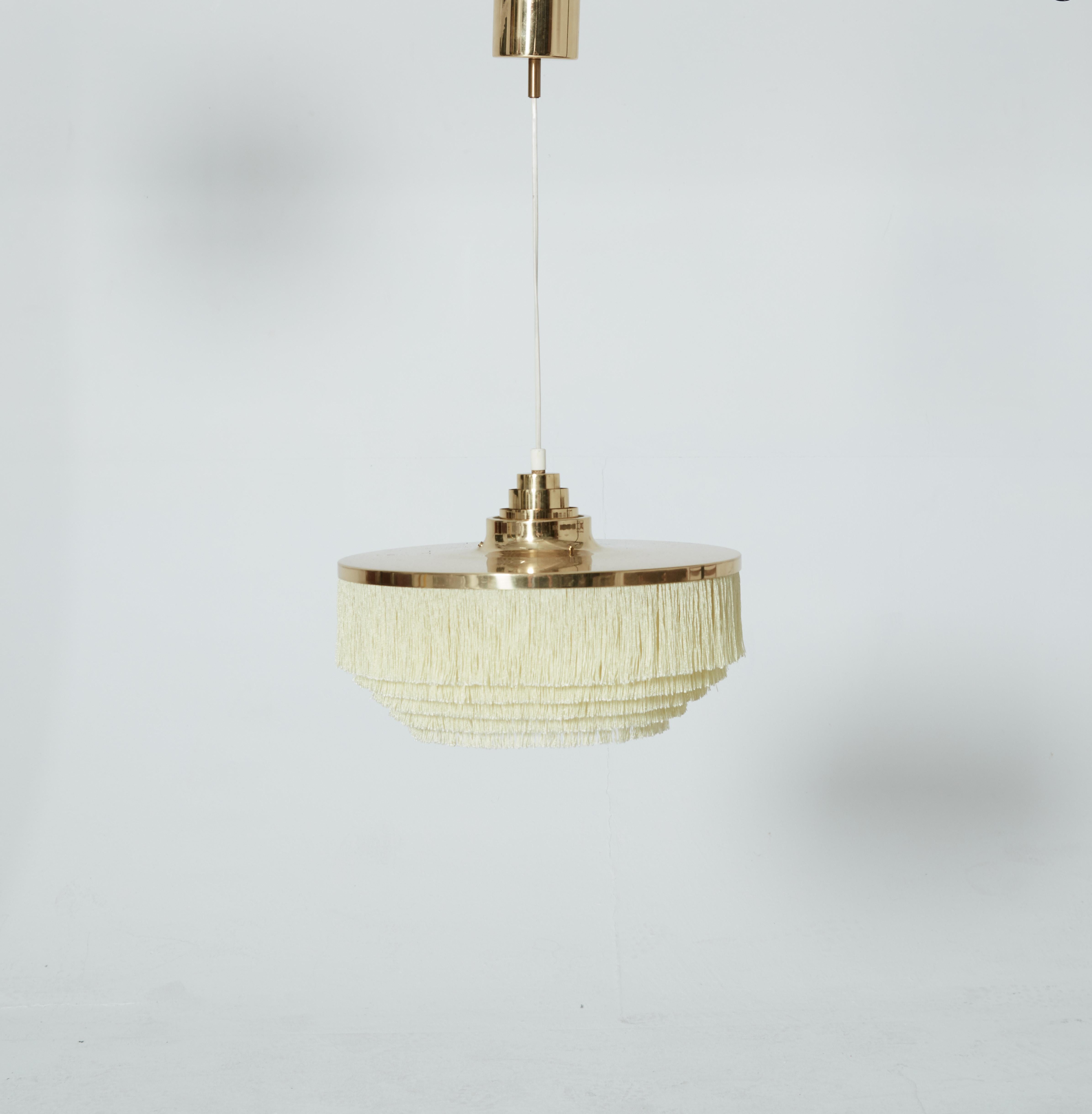 Hans Agne Jakobsson brass and silk fringed pendant lamp, Sweden, 1960s. Excellent condition. Height is adjustable.