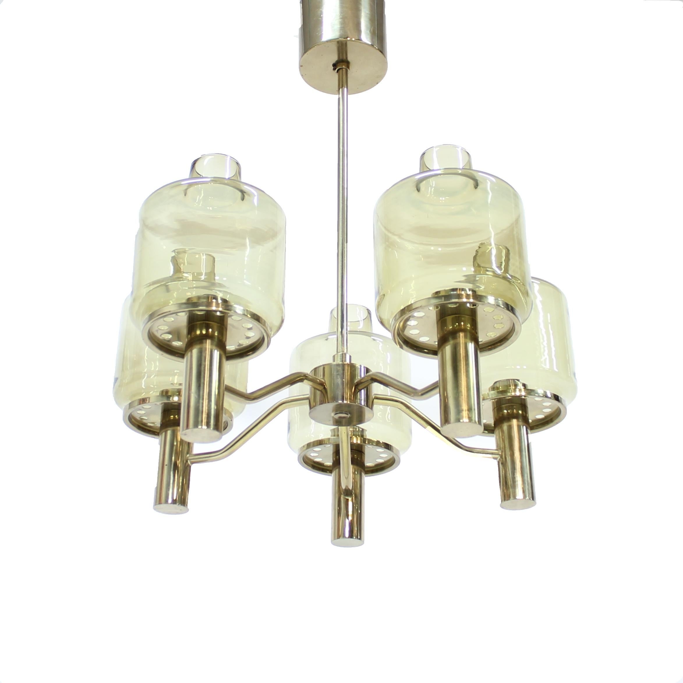 Brass ceiling light with glass shades, model T507, designed by Hans-Agne Jakobsson for his own company in the 1960s. It contains five smoke coloured glass shades with a hint of yellow. Untouched vintage condition with very light ware consistent with