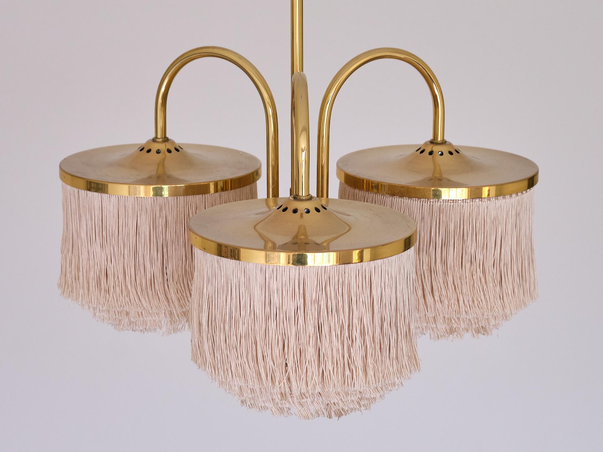This striking three arm pendant light was designed by Hans-Agne Jakobsson in the 1960s. This particularly rare model was numbered T-608 and is part of his iconic 'Fringe' series produced by his own company Hans-Agne Jakobson AB in Markaryd, Sweden.