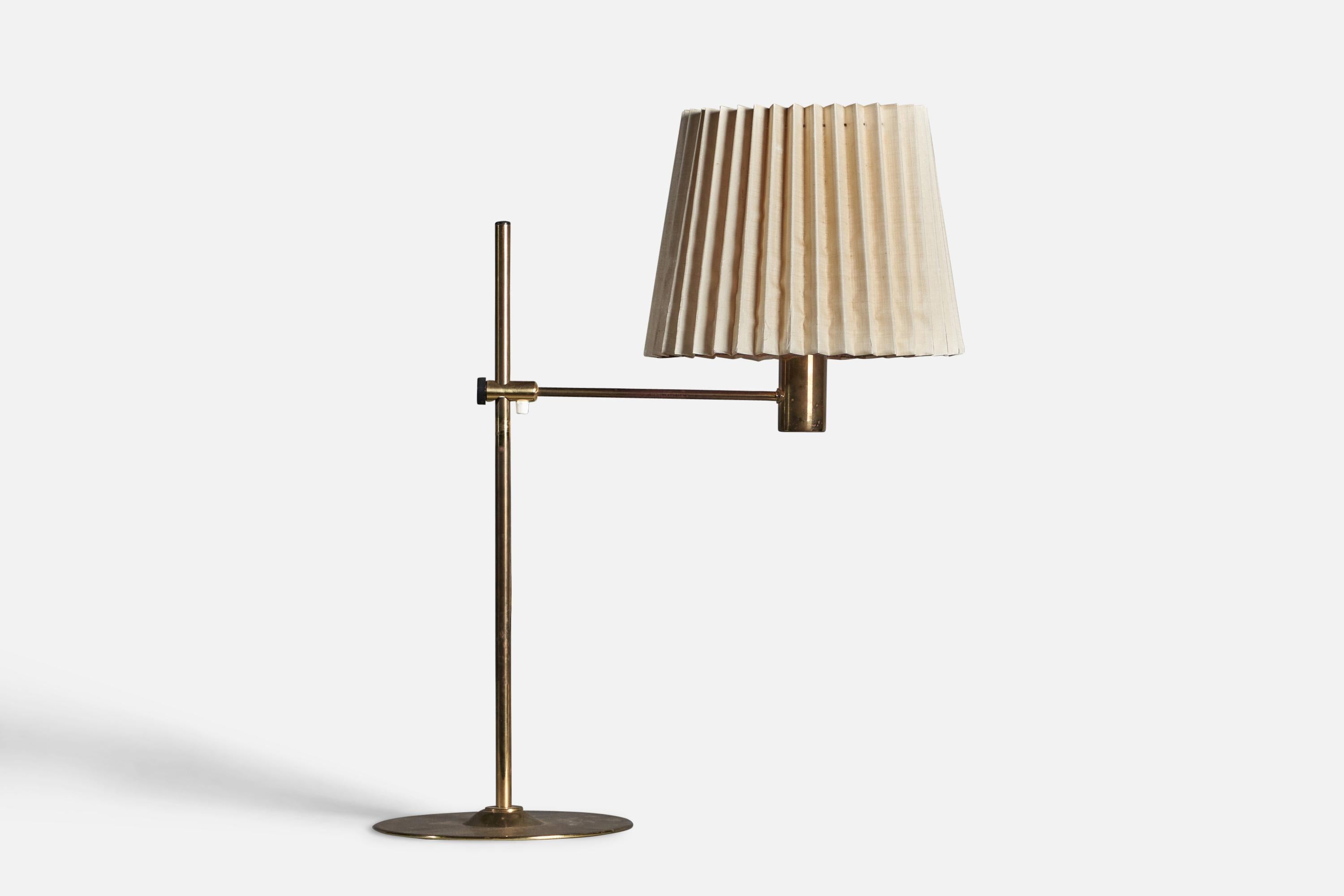 An adjustable brass and beige fabric table lamp designed and produced in Sweden, 1970s.

Overall Dimensions (inches): 28.5” x 13” W x 26” D
Bulb Specifications: E-26 Bulb
Number of Sockets: 1
Original lampshade in distressed condition, ideally
