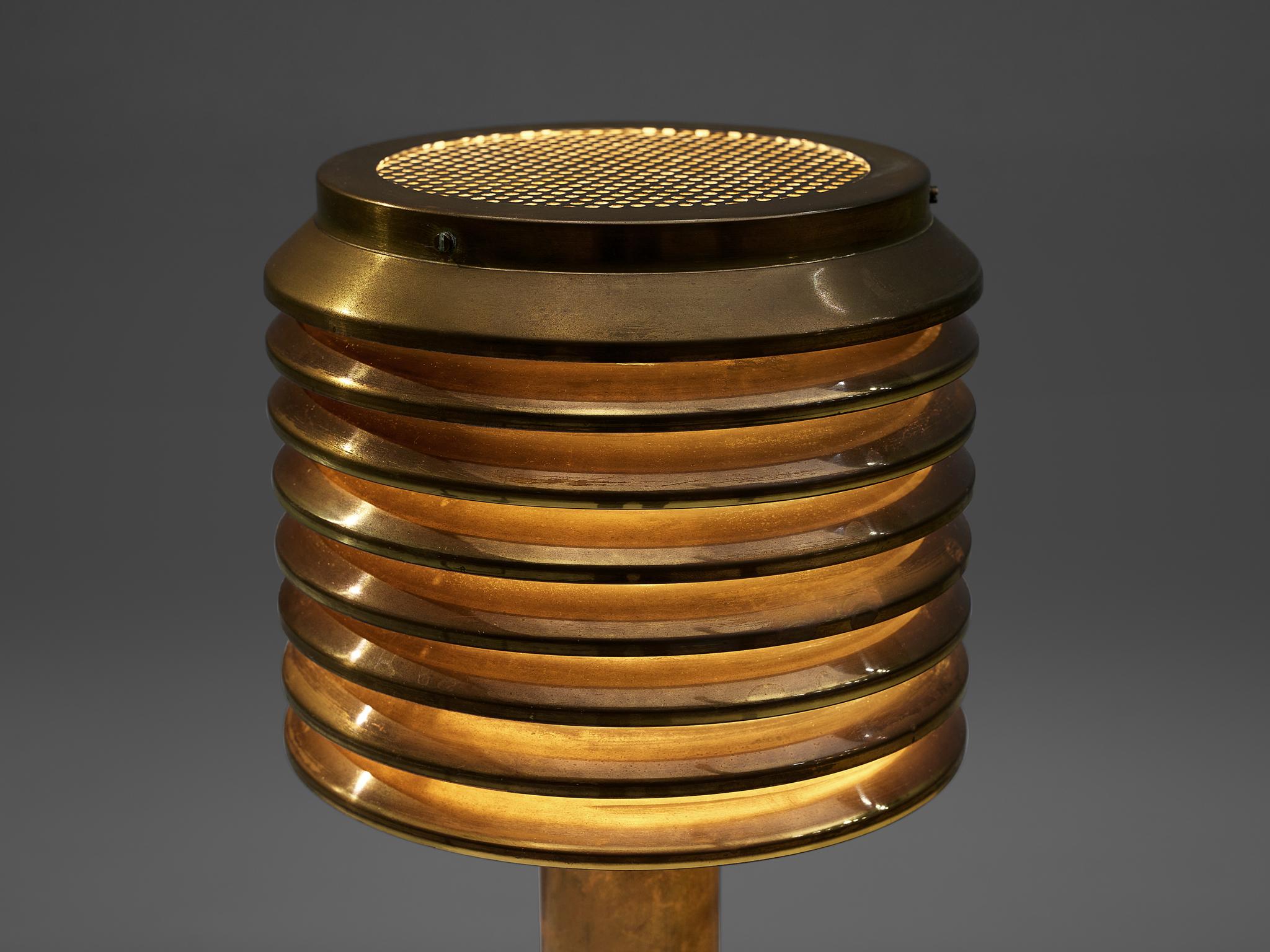 Hans-Agne Jakobsson, table lamp B-142, brass, Sweden, 1960s

This lamp features a brass foot that holds a brass shade. The shade consists of several layers, that create a rhythmic, atmospheric play of indirect light. Admirable patina adds even