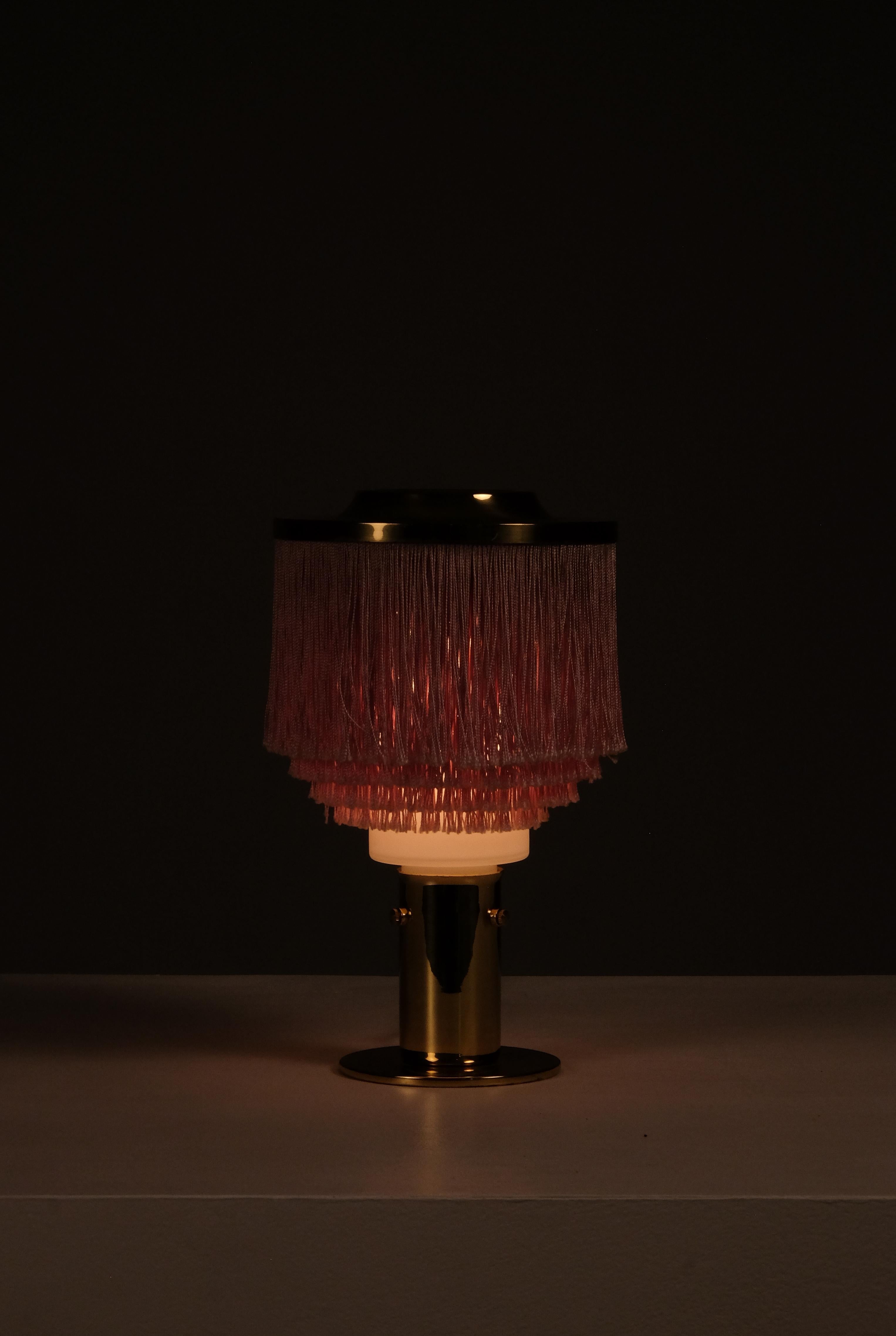 Fringes, brass and opaline glass shade. Produced by Hans-Agne Jakobsson, Markaryd, 1960s.