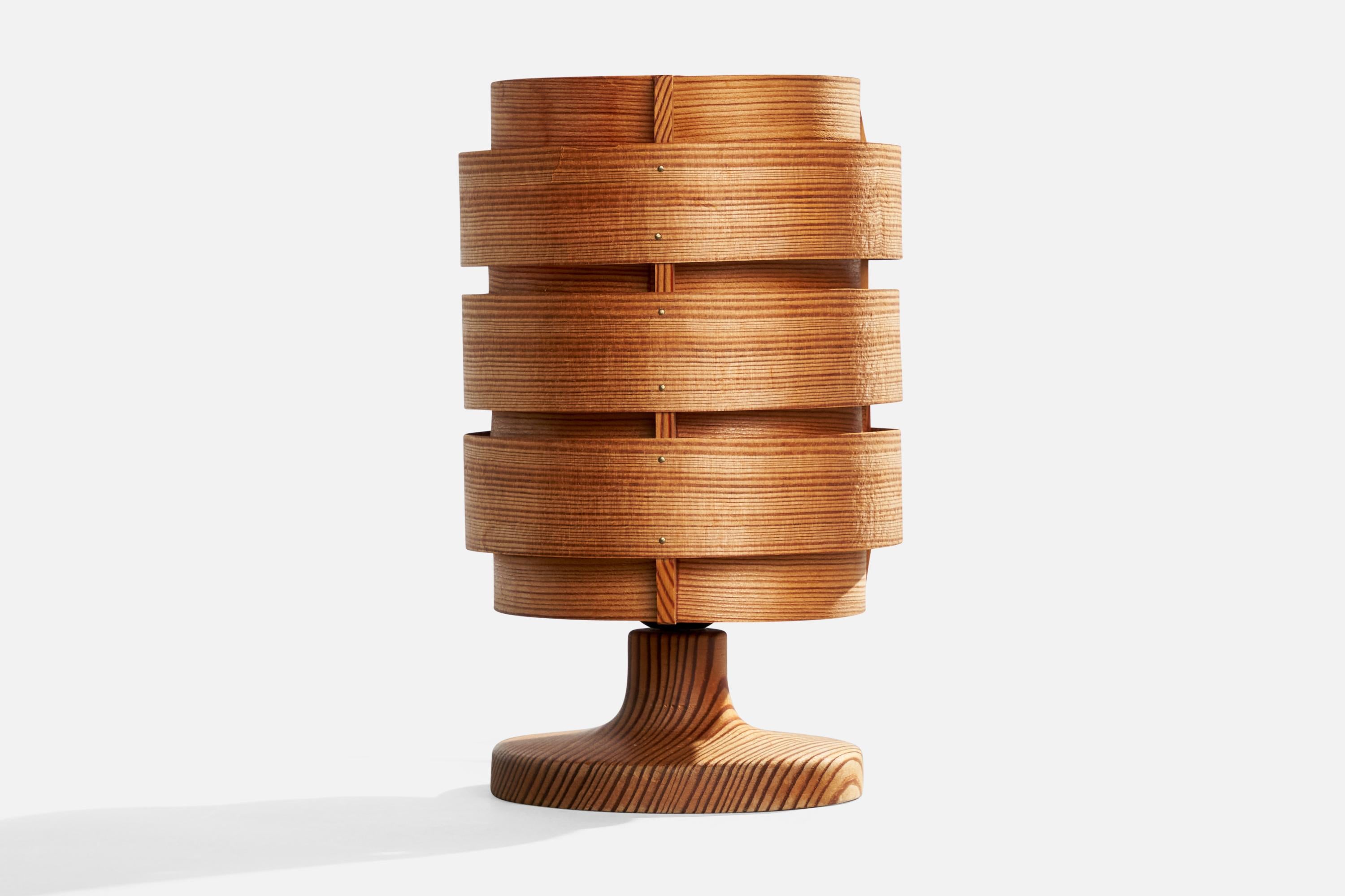 A pine table lamp designed by Hans-Agne Jakobsson and produced by Elysett, Sweden, c. 1970s.

Dimensions of Lamp with Shade (inches): 9.8“ H x 6“ Diameter

Bulb Specifications: E-26 

Number of Sockets (per fixture): 1

Sold with lampshade.

All