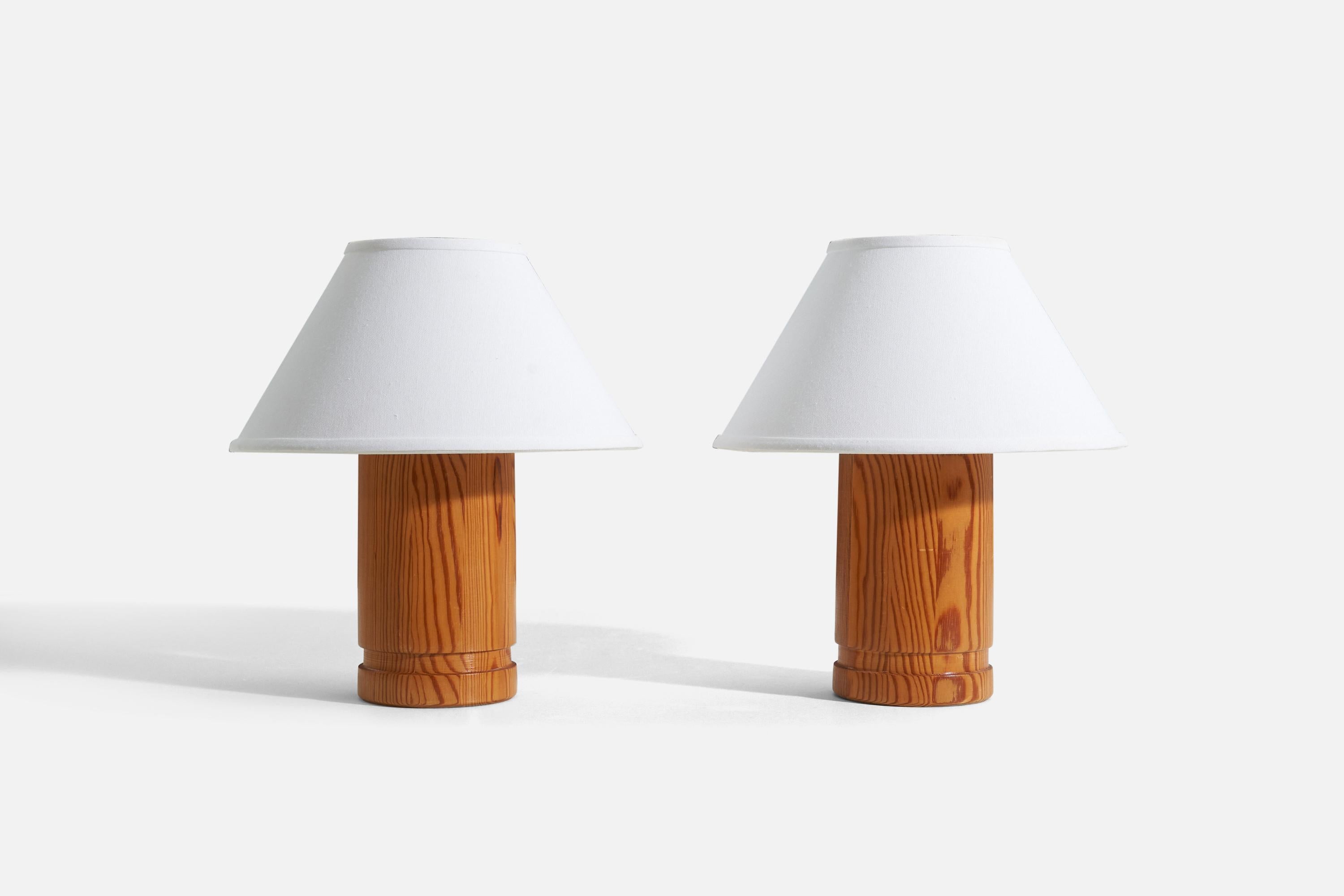 A pair of light wood table lamps designed by Hans-Agne Jakobsson, Sweden, 1970s. Marked with makers label 