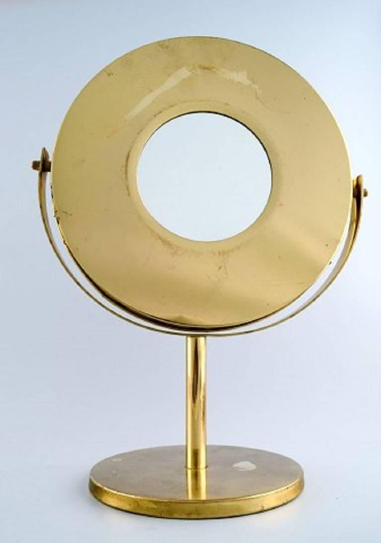 Hans-Agne Jakobsson, table mirror / make-up mirror of brass.
Designed approximate 1960s, Sweden.
In perfect condition.
Measures: 38 cm x 27 cm.
Label sticker.