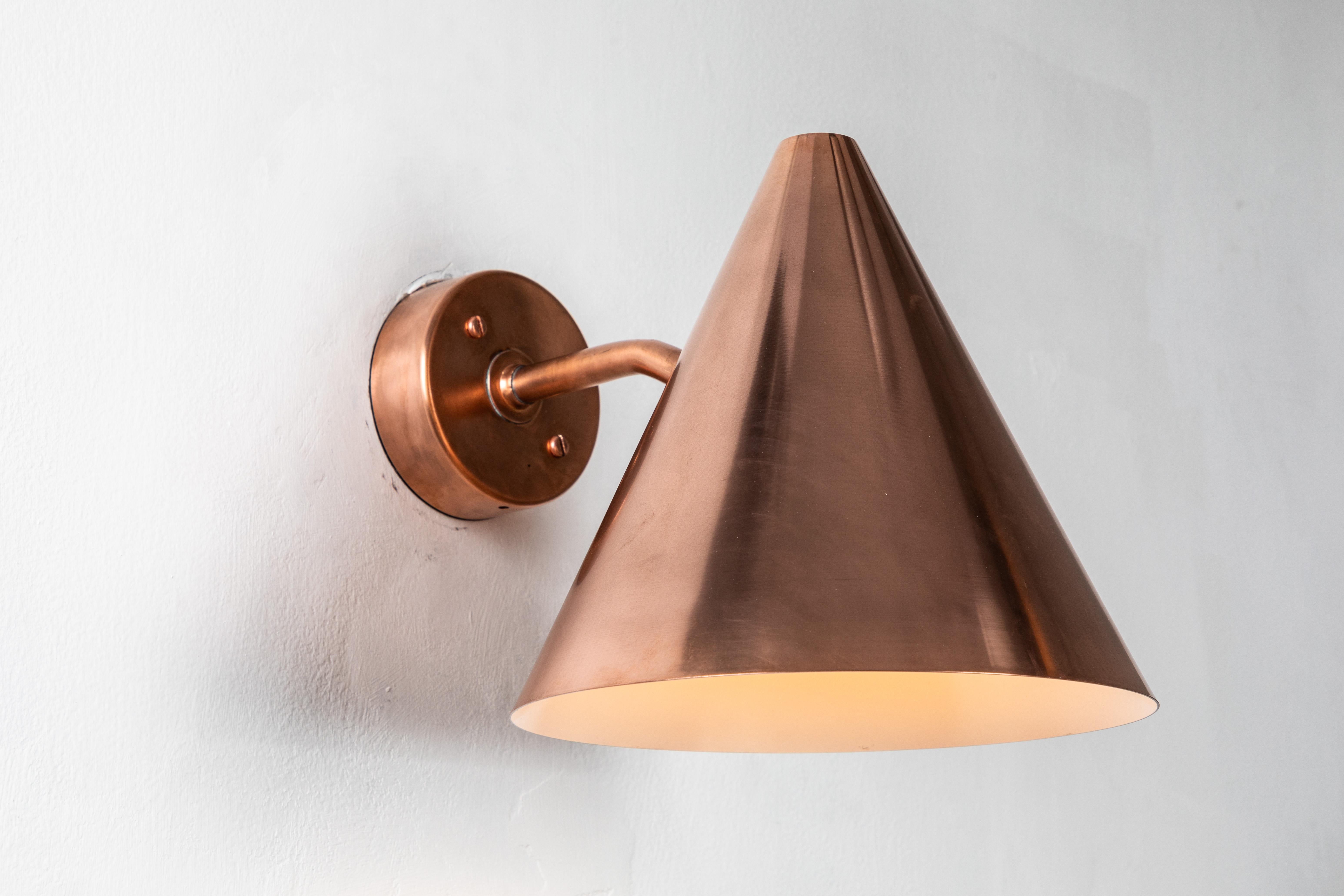 Hans-Agne Jakobsson 'Tratten' raw copper outdoor sconce. An exclusive made for U.S. and UL listed authorized re-edition of the classic Swedish design executed in raw unlacquered polished copper with white painted interior. Suitable for both outdoor