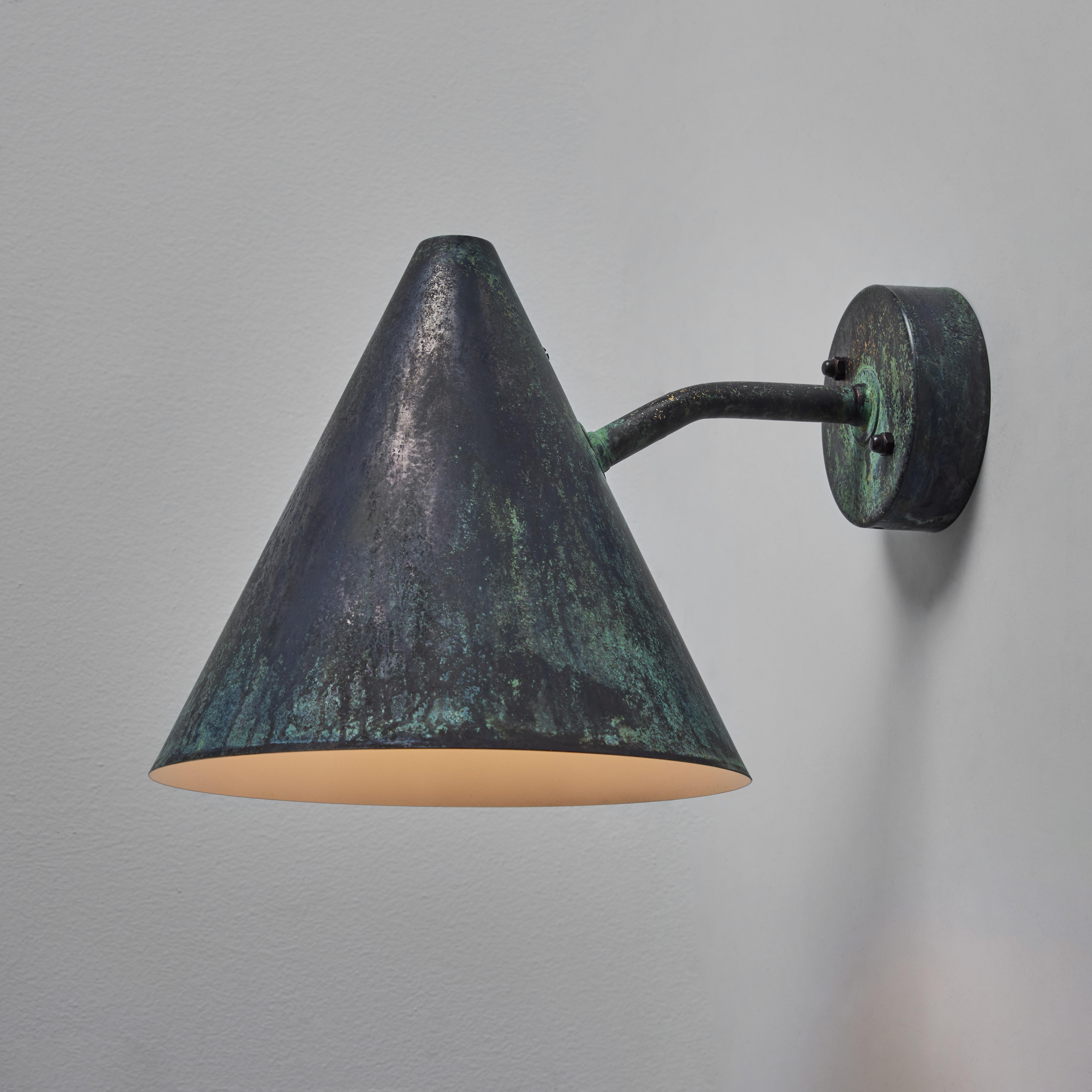 Hans-Agne Jakobsson 'Tratten' darkly patinated outdoor sconce. An exclusive made for U.S. and UL listed authorized re-edition of the classic Swedish design executed in richly and darkly patinated metal with white-painted interior. Suitable for both