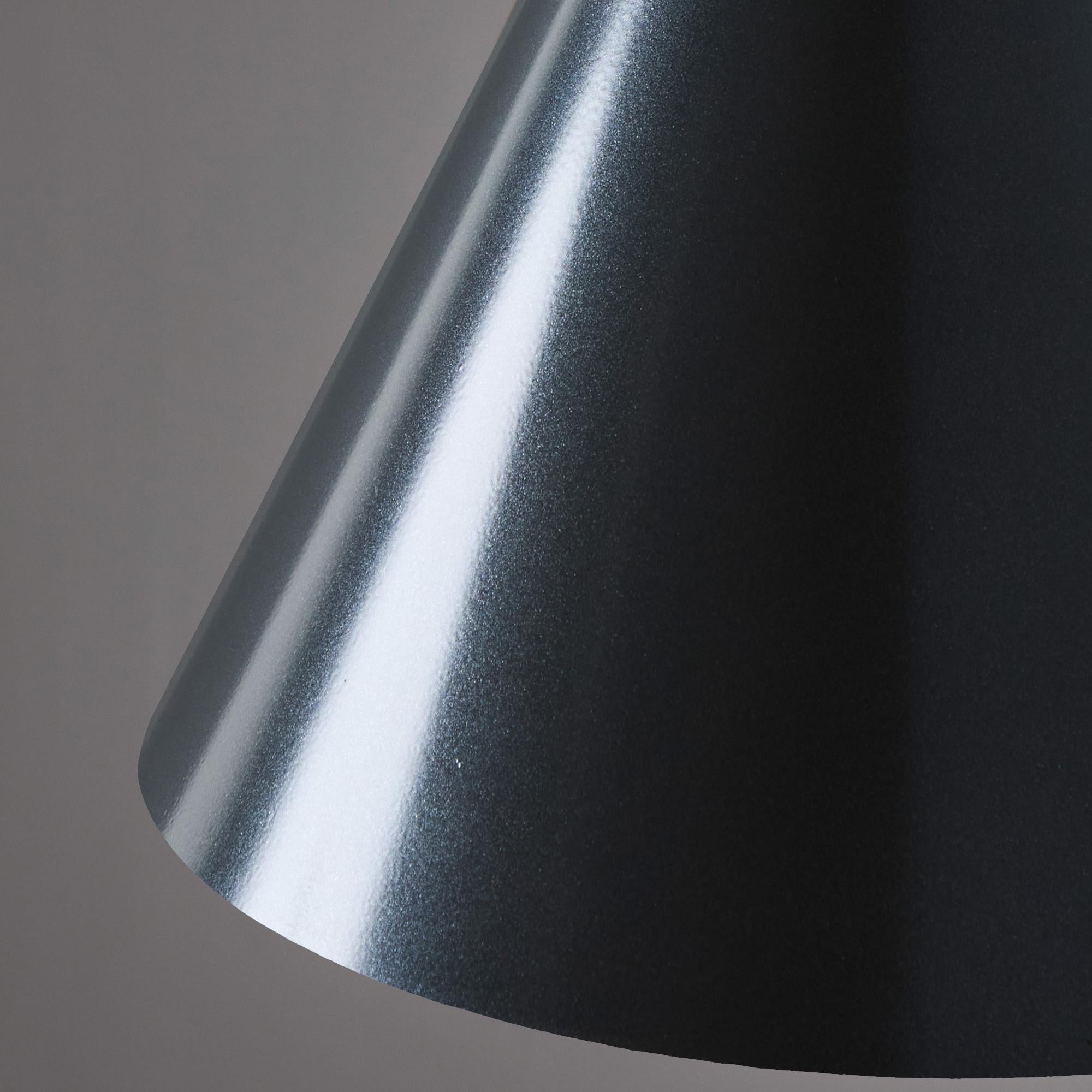 Hans-Agne Jakobsson 'Tratten' Outdoor Pendant in Steel.

An exclusive made for U.S. and UL listed authorized re-edition of the classic Swedish design from Jakobsson, executed in steel-colored painted metal with a burnished interior finish. An