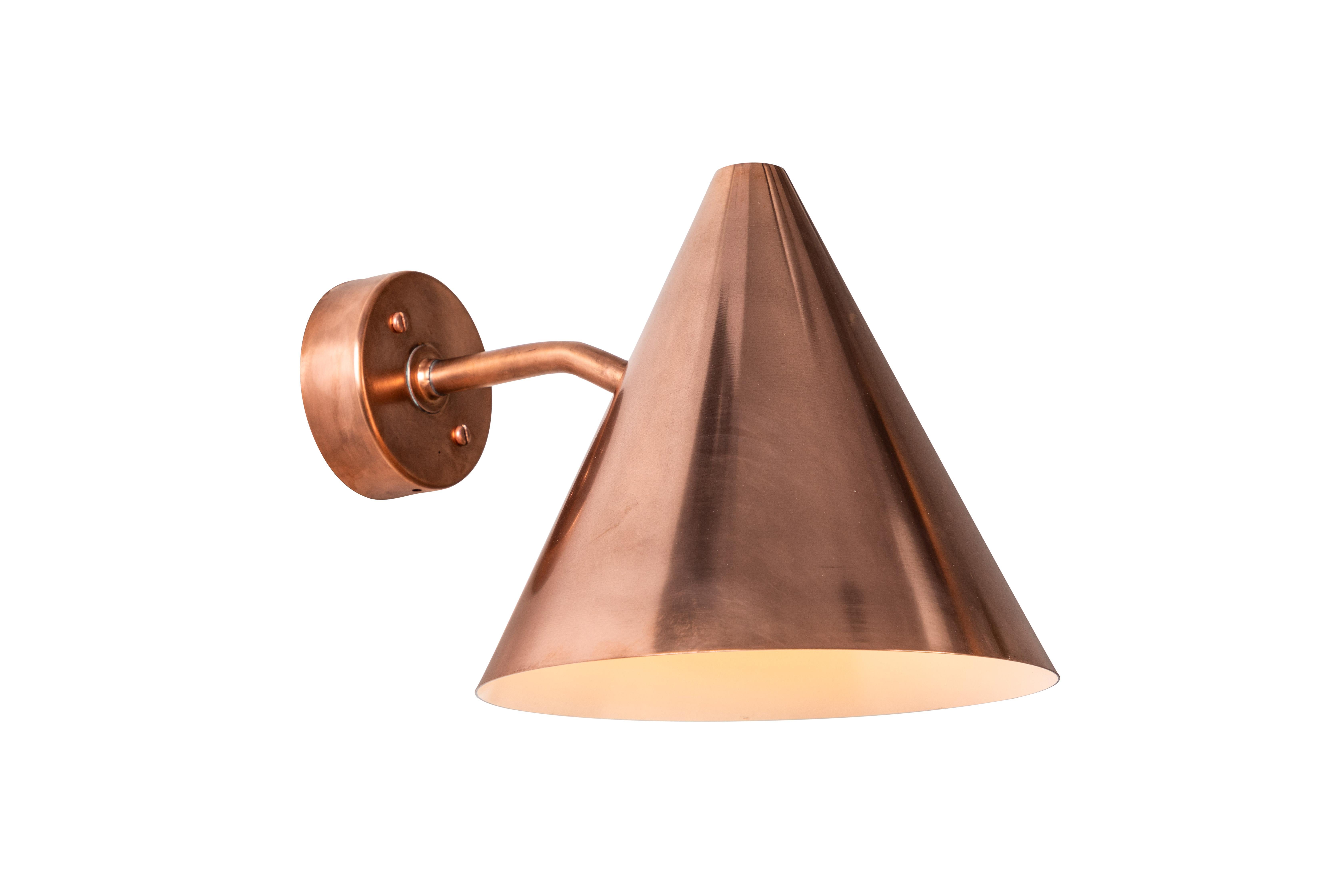 Pair of Hans-Agne Jakobsson 'Tratten' raw copper outdoor sconces. An exclusive made for U.S. and UL listed authorized re-edition of the classic Swedish design executed in raw un-lacquered polished copper with white painted interior. Suitable for